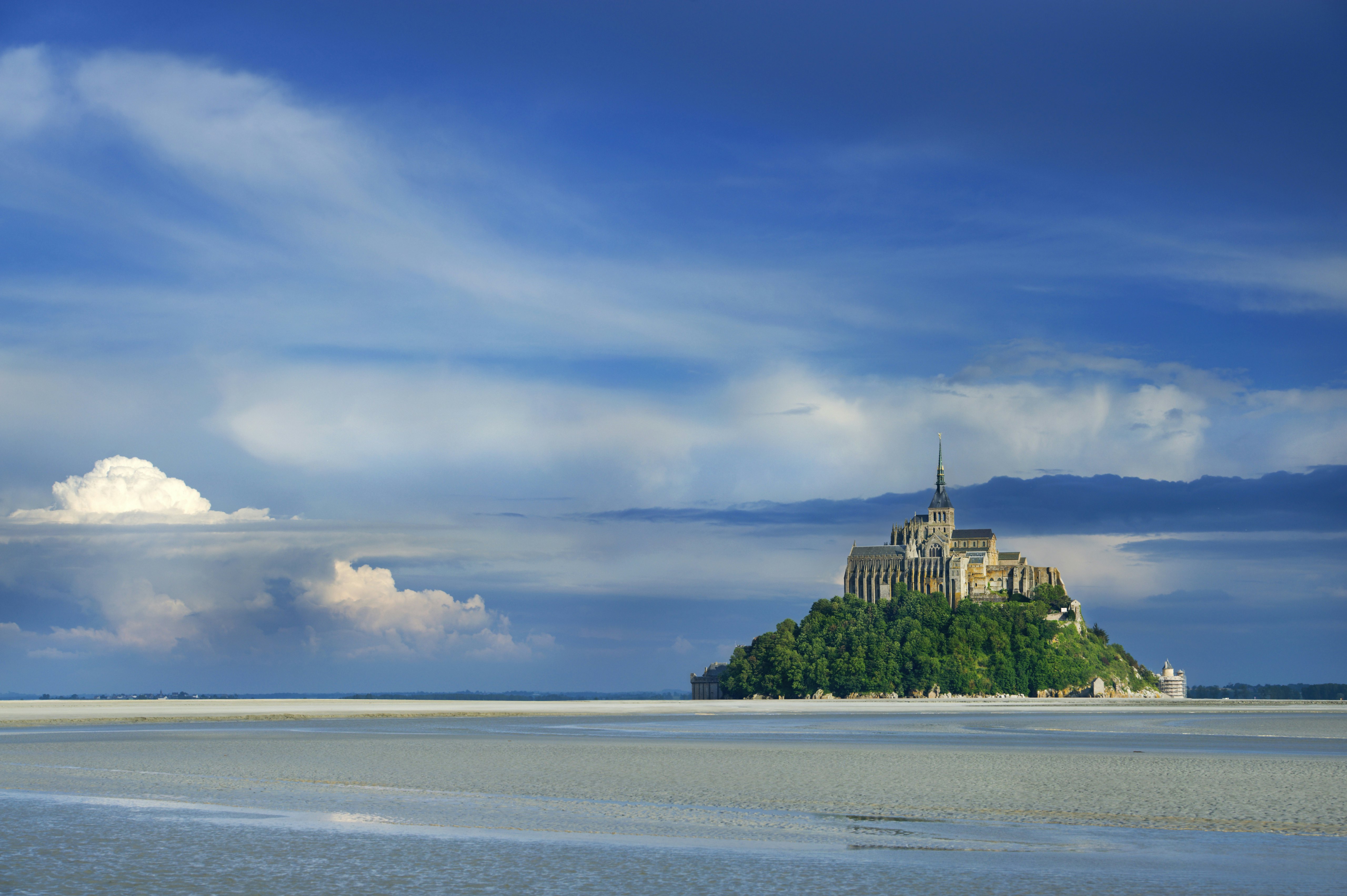 Mont St-Michel at mouth of Couesnon River at low tide.