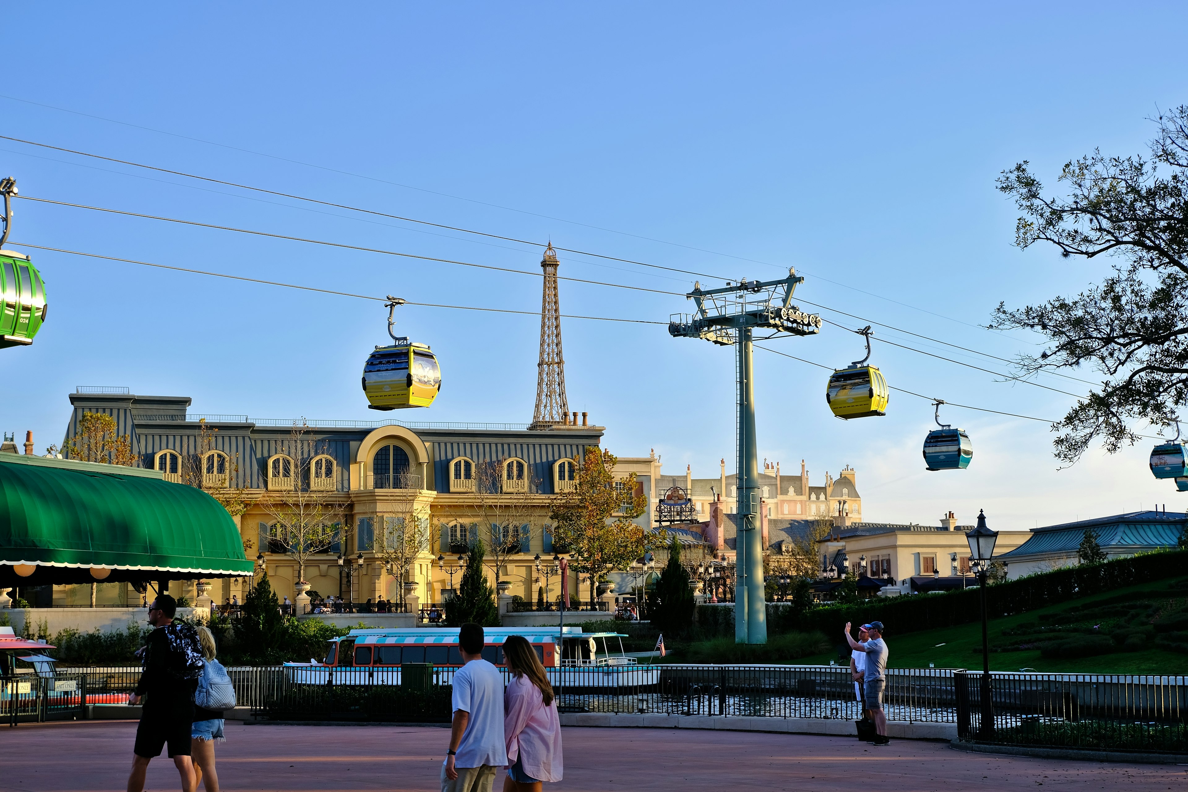 The skyliner at Disney World sails over Epcot's Paris