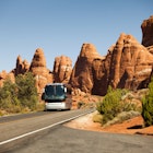 A bus passes through Arches National Park in Utah.