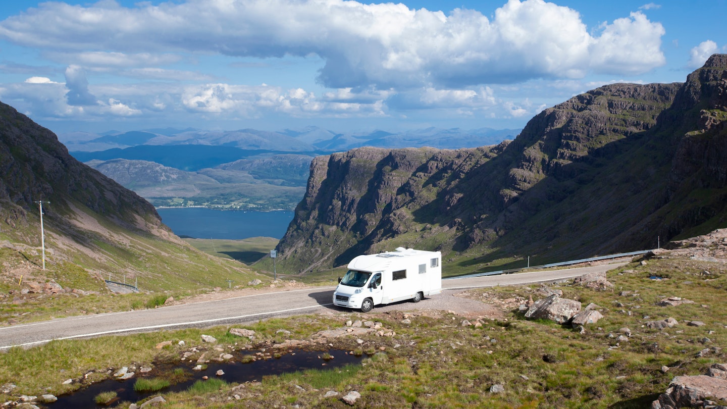 Motorhome parked at the side of the road near Bealach na Ba and Applecross in summer in the Scottish Highlands with blue skies, License Type: media, Download Time: 2024-09-23T21:42:32.000Z, User: robinbarton170, Editorial: false, purchase_order: 56530, job: Global Publishing-WIP, client: Epic Van Trips of Europe 1, other: Robin Barton