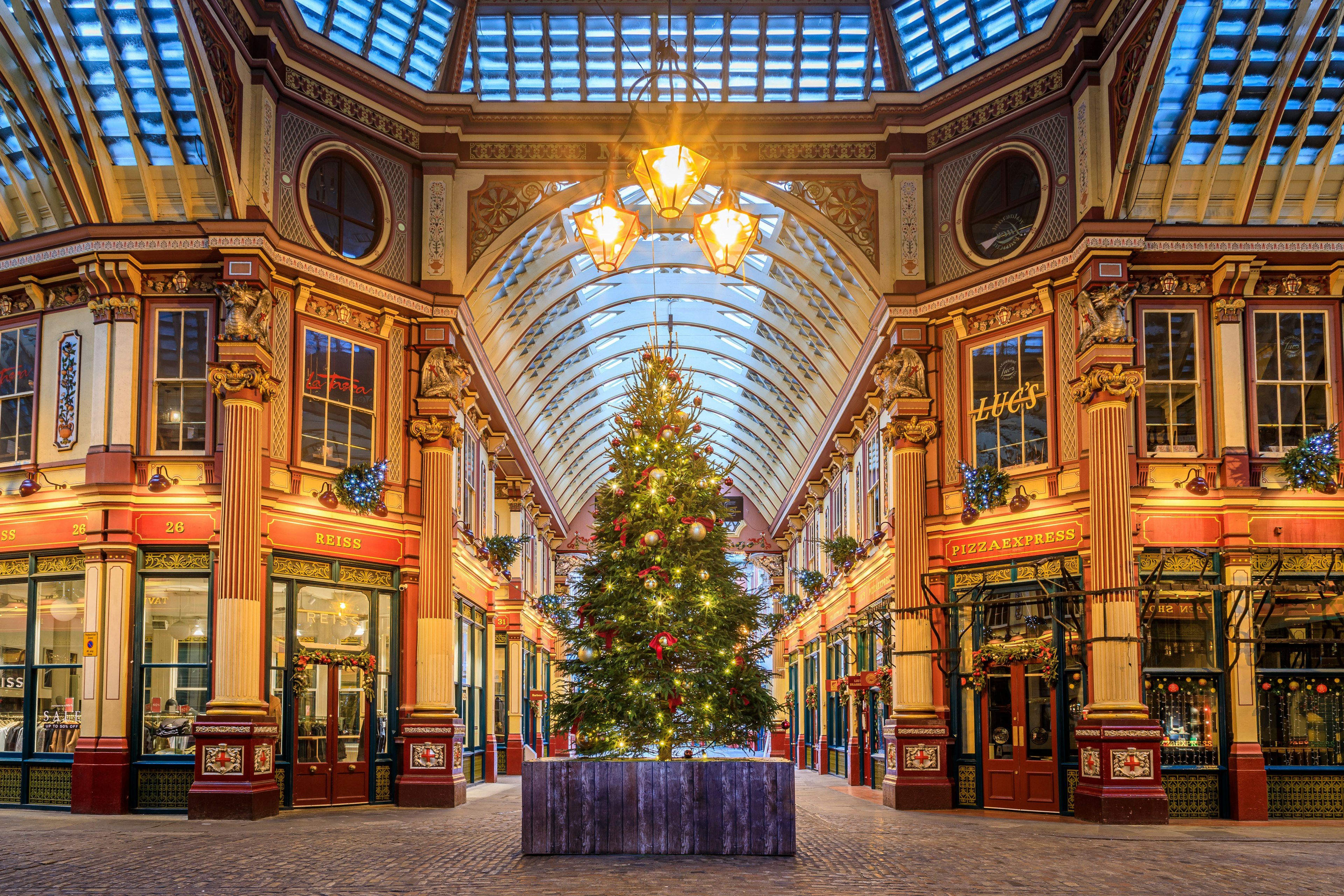 London, UK - Dec 30, 2018: A Christmas tree was decorated and placed in the center of the historic Leadenhall Market, which was located at financial district of London to celebrate the new year's day.