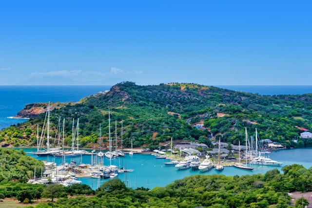 A panoramic view of masted ships and yachts moored at Nelson’s Dockyard National Park, Antigua, Antigua & Barbuda