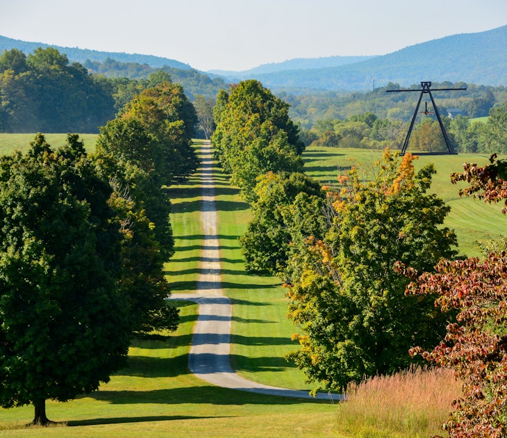 New Windsor, NY, USA-Sept 2019; Panoramic view over the dirt road, grasslands and forest and one of the steel sculptures of Storm King Art Center, License Type: media, Download Time: 2024-09-01T16:59:08.000Z, User: pinkjozie64, Editorial: true, purchase_order: 56530, job: Global Publishing WIP, client: Experience New York 2, other: Jo-anne Riddell