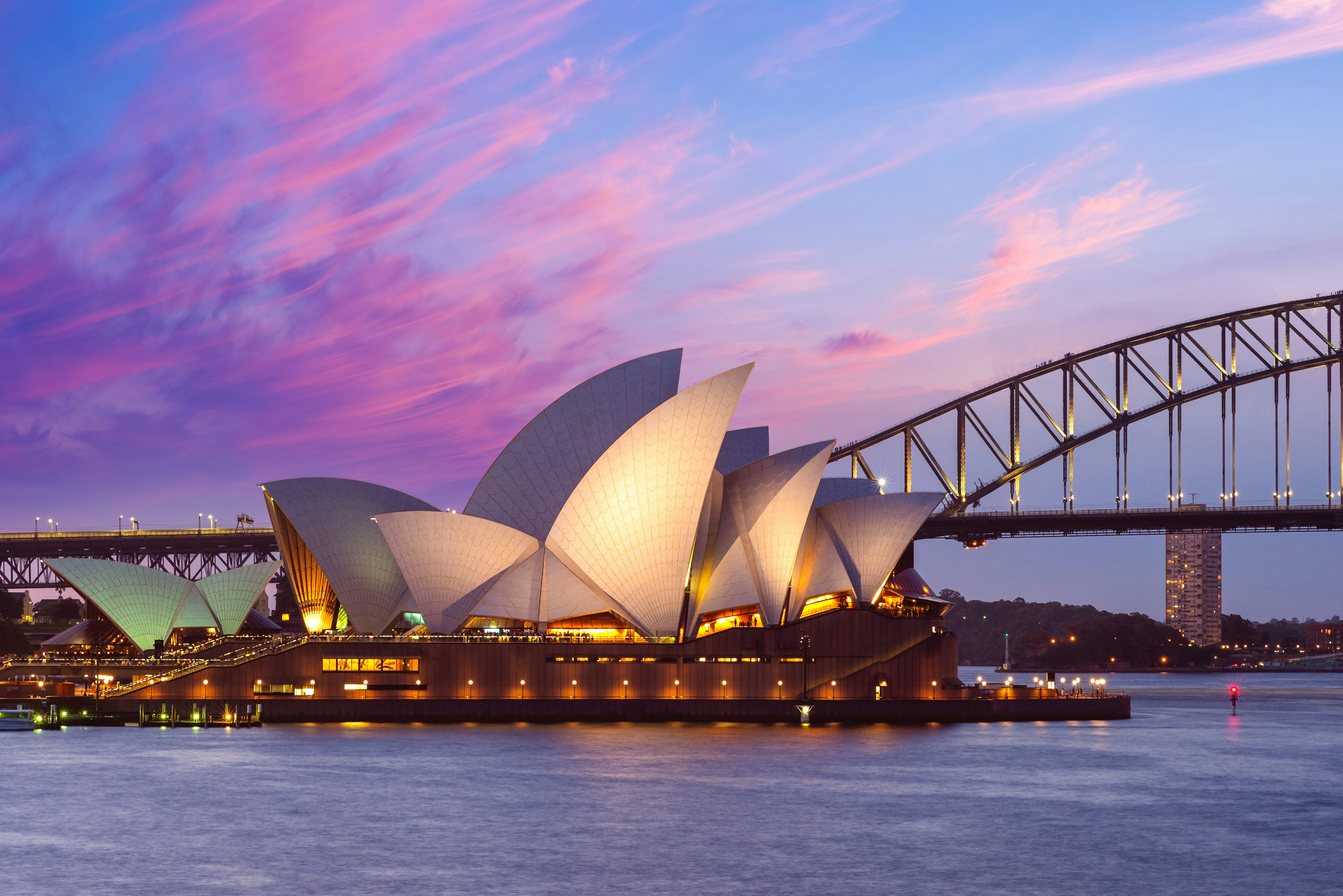 Admiring the Sydney Opera House at dusk.