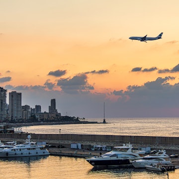 Beirut, Lebanon 09-04-2019: A plane landing over Beirut waterfront skyline during sunset, License Type: media, Download Time: 2024-07-29T17:46:07.000Z, User: nic.dhoedt_lonelyplanet, Editorial: true, purchase_order: 56530, job: Global Publishing WIP, client: Lonely Planet Middle East 10, other: Nicolas D'Hoedt