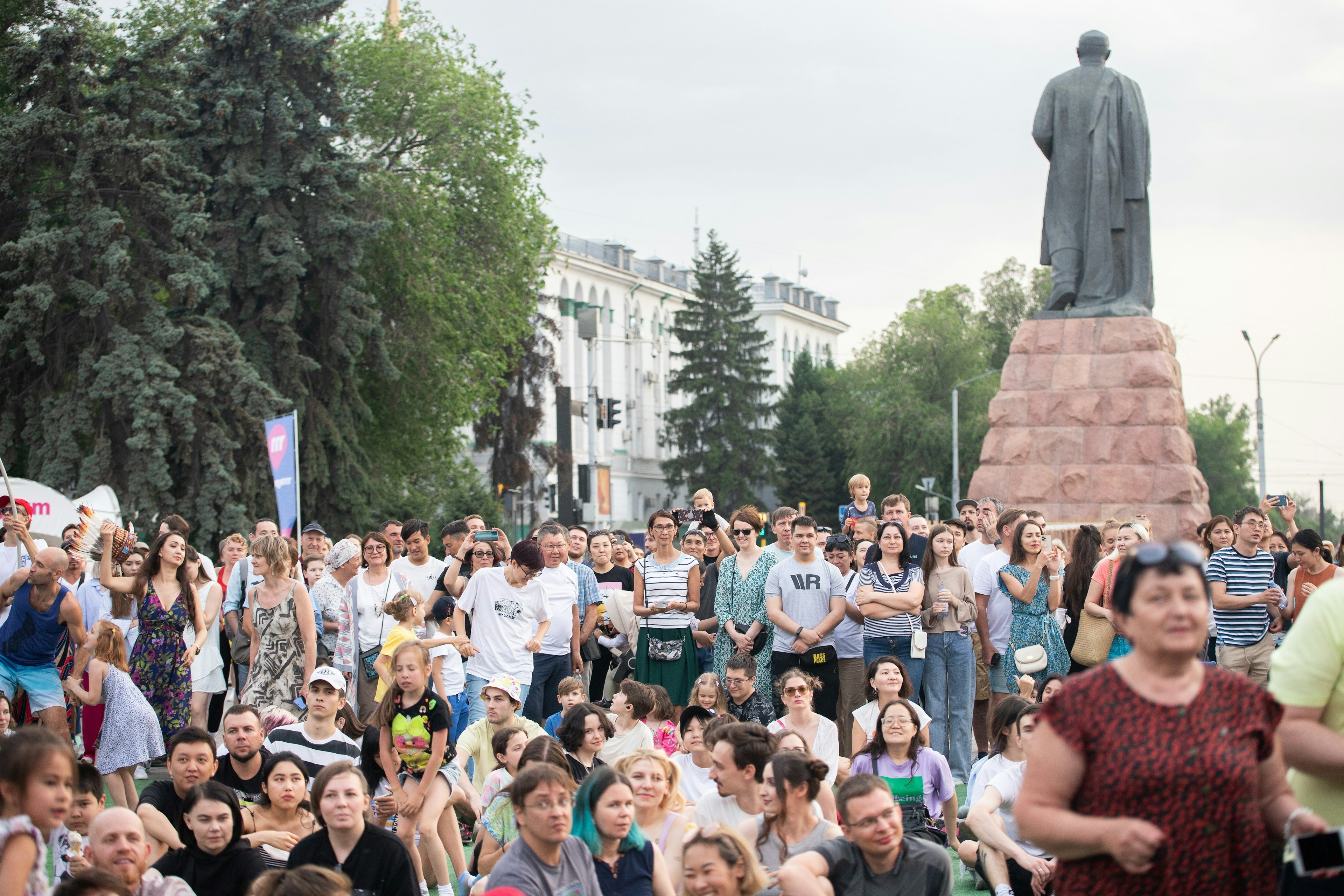 A diverse crowd of fans await performances at a music festival on Abay Square, in front of the Palace of the Republic, in Almaty, Kazakhstan