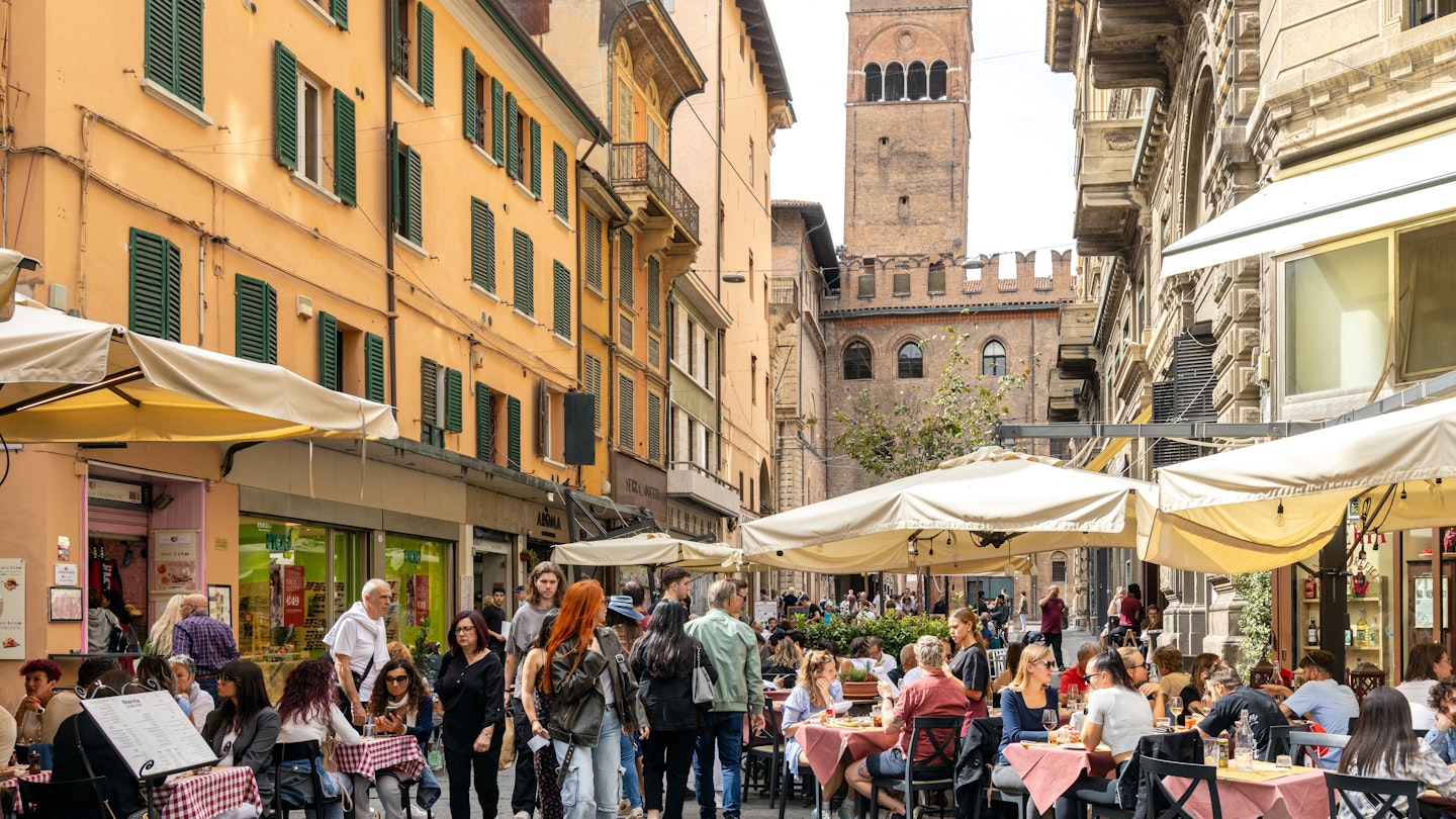 Bologna, Italy - Sep 15th, 2024: Busy street with people enjoying outdoor dining and the Torre dell'Arengo in the background; Shutterstock ID 2528022745; purchase_order: 65050 - Digital Destinations and Articles ; job: Lonely Planet; client: Where to eat in Bologna; other: Sasha Brady
2528022745
Outdoor restaurant terraces in Bologna