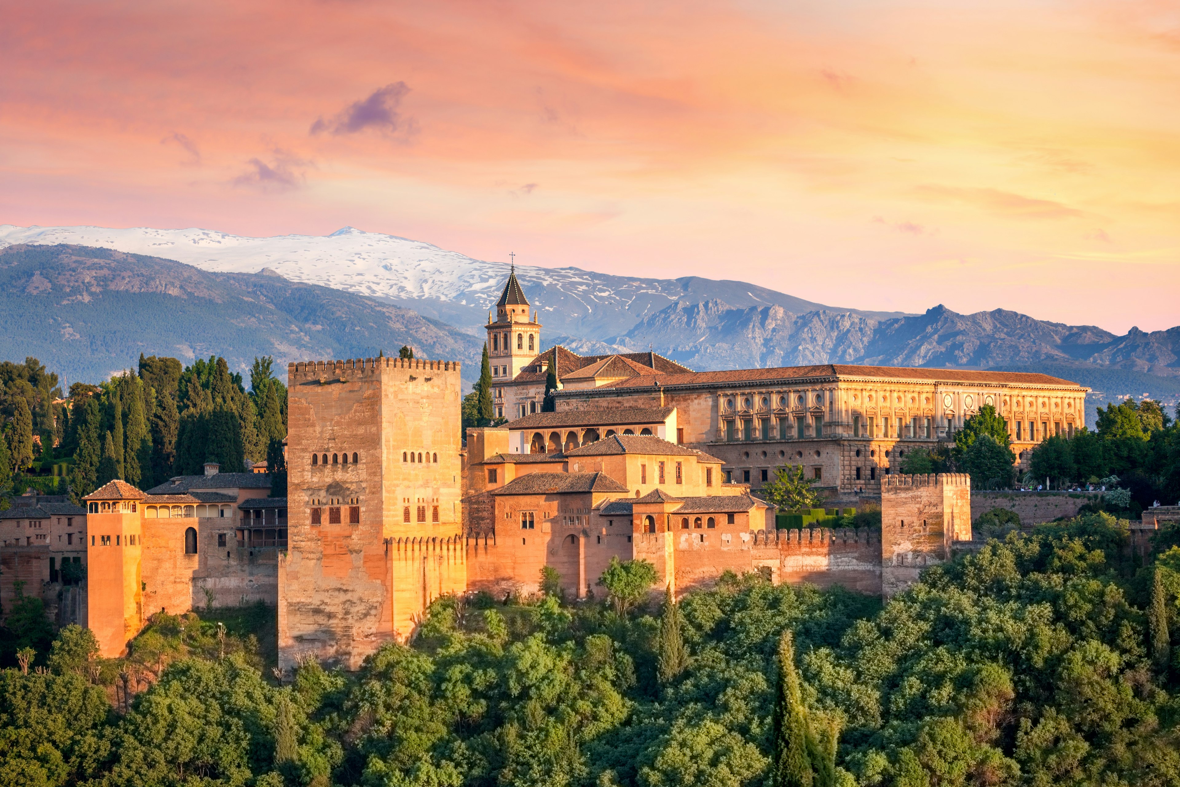 Ancient arabic fortress Alhambra at the beautiful evening time, Granada, Spain.