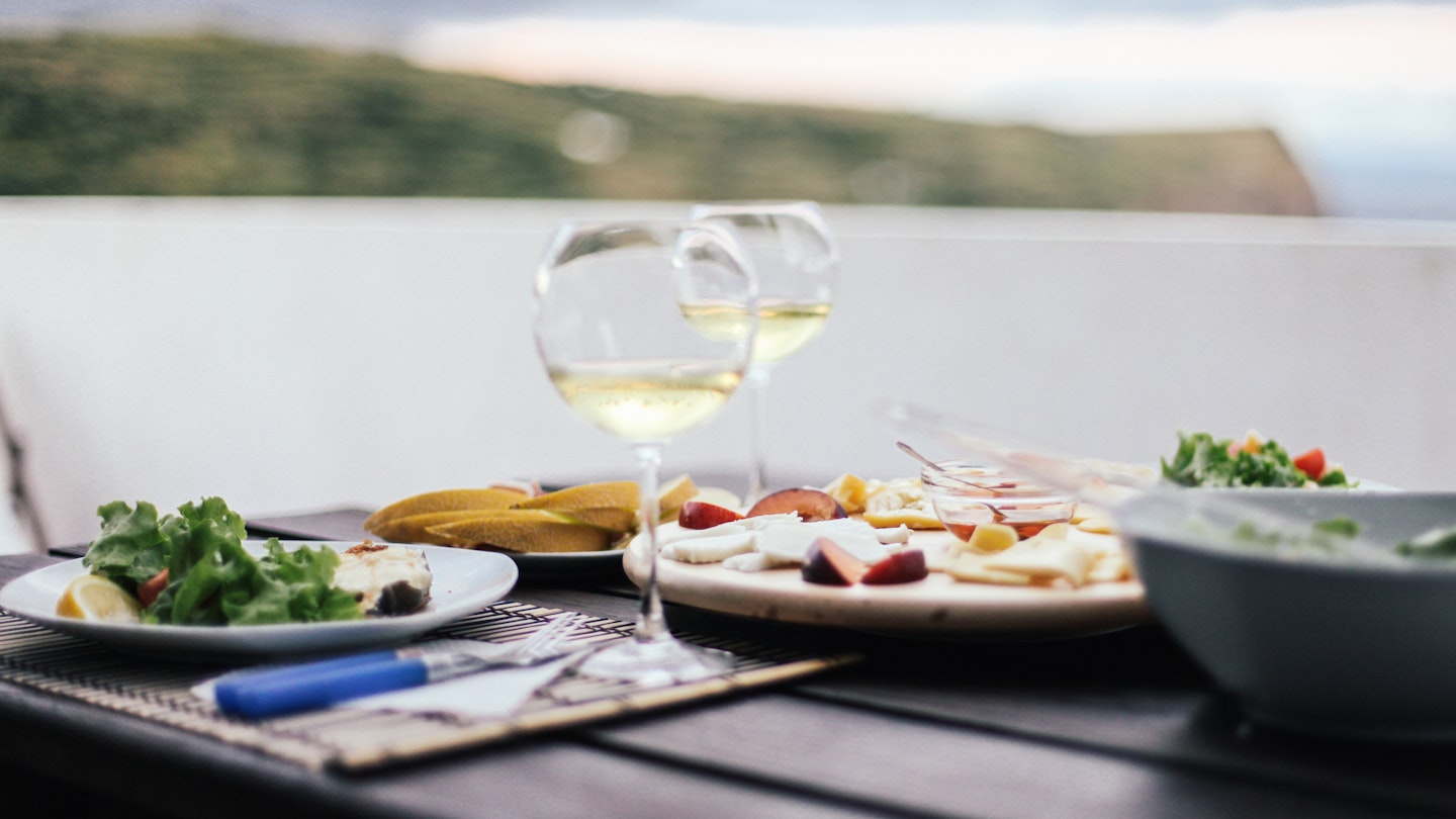 White wine, cheese plate. Dinner on sunset with amazing view on mountain Pico, Azores, Portugal, Europe, License Type: media_digital, Download Time: 2024-10-18T09:32:13.000Z, User: clairenaylor, Editorial: false, purchase_order: 65050 - Digital Destinations and Articles , job: Online editorial, client: Azores eat drink, other: Claire Naylor