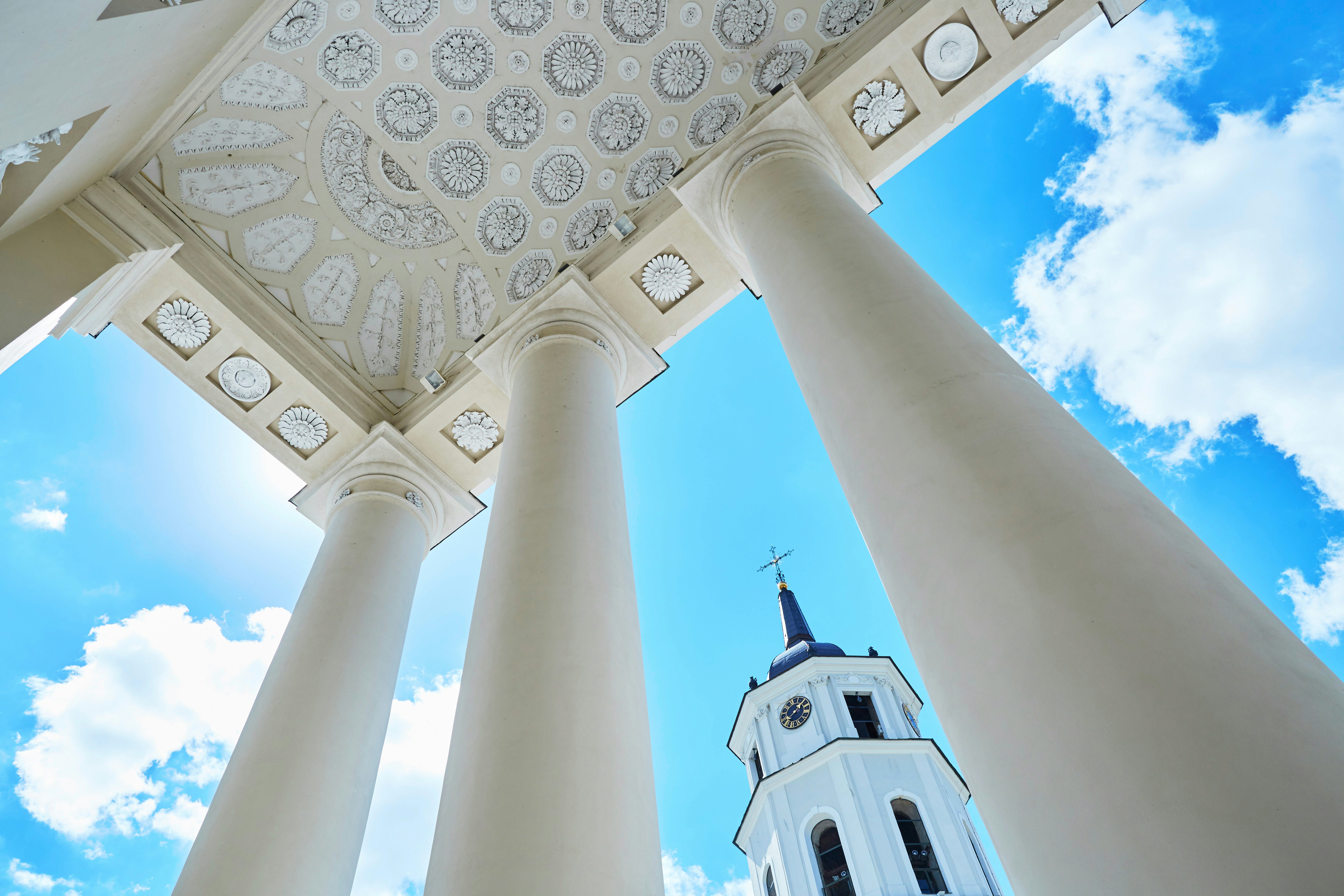 Vilnius Cathedral's bell tower seen through its towering classical columns