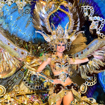 Performer wearing an elaborate costume at The Carnival in Santa Cruz de Tenerife.
