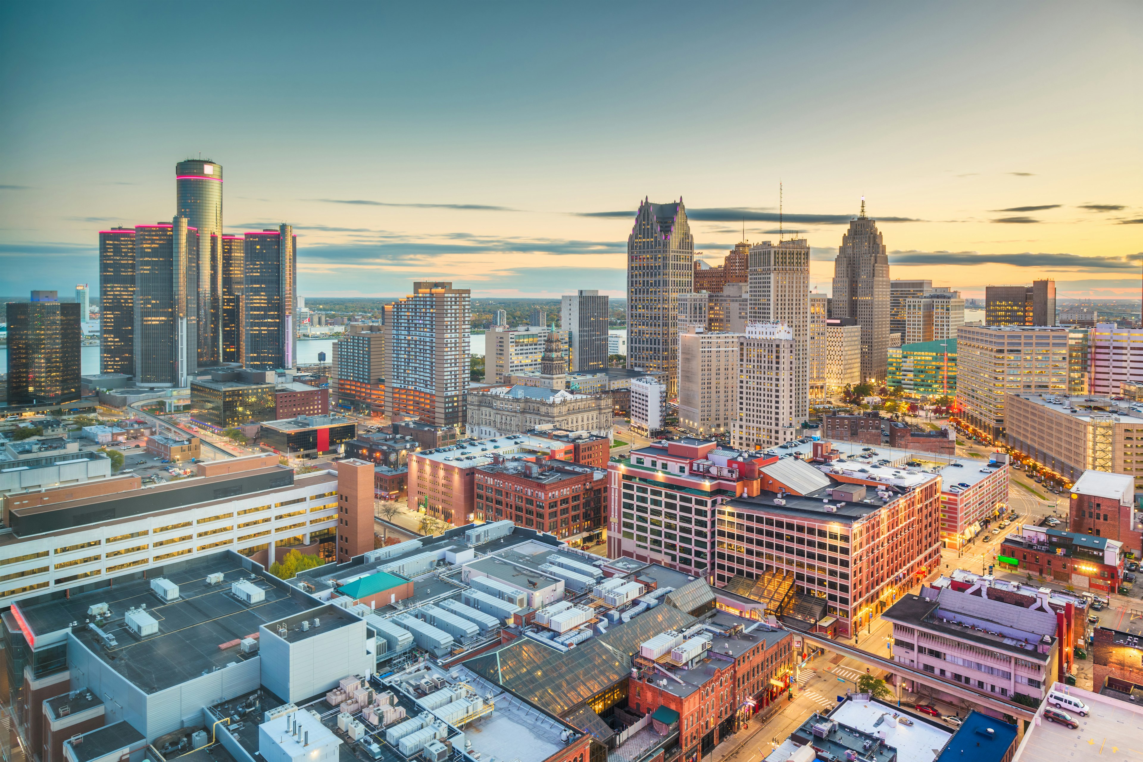 Aerial of downtown Detroit's city skyline at dusk.