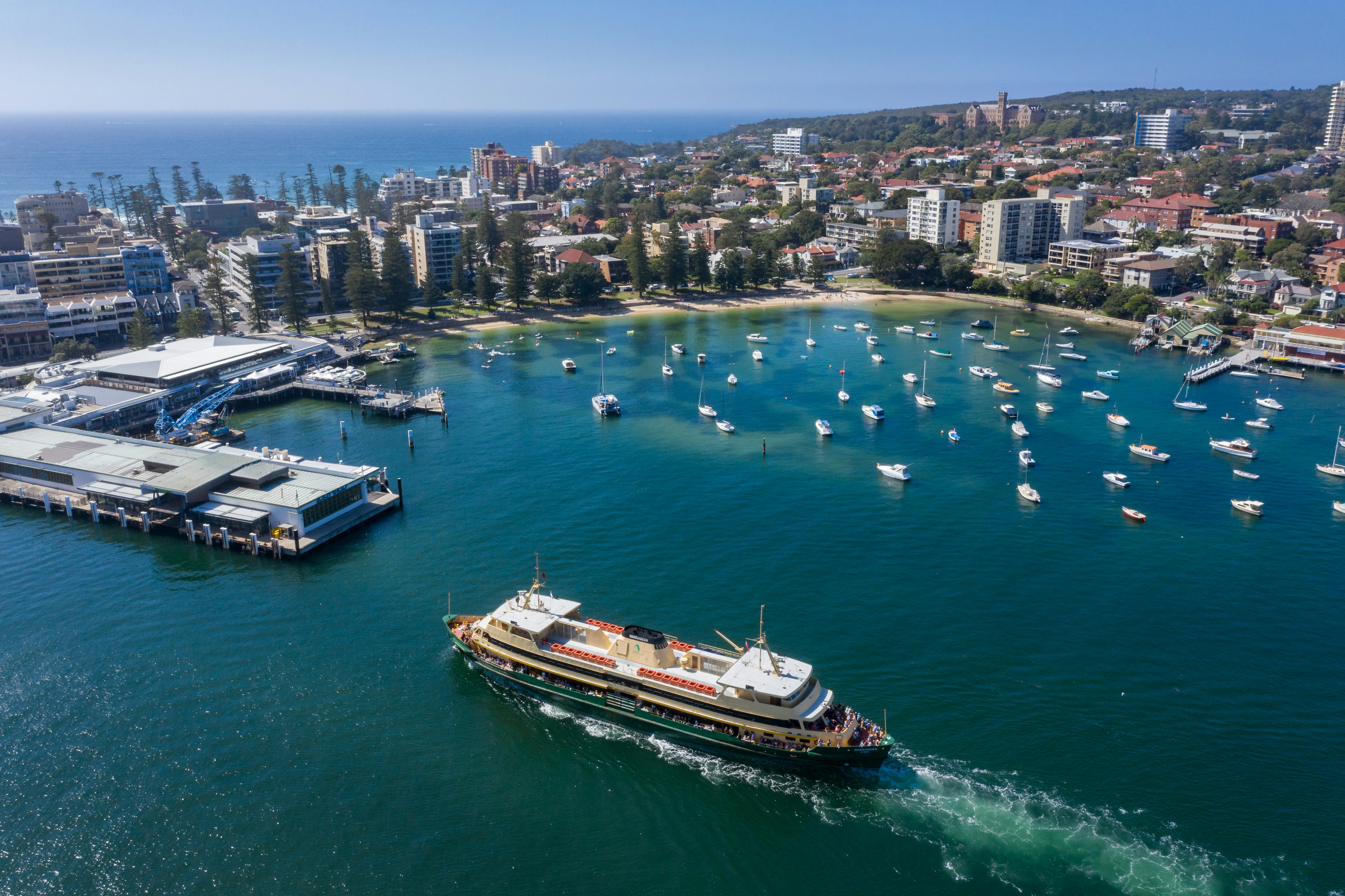 Aerial view of the Circular Quay ferry approaching Manly Wharf and harbour in Sydney, Australia