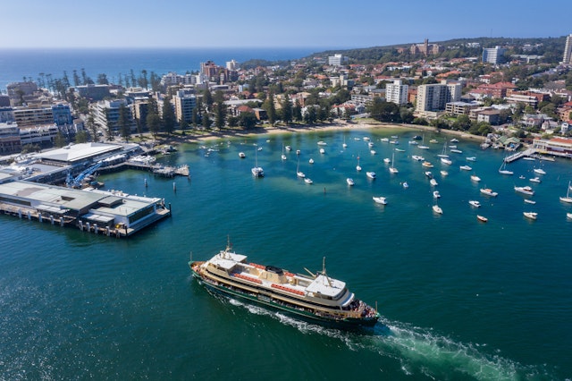 Aerial view of the Circular Quay ferry approaching Manly Wharf and harbour in Sydney, Australia