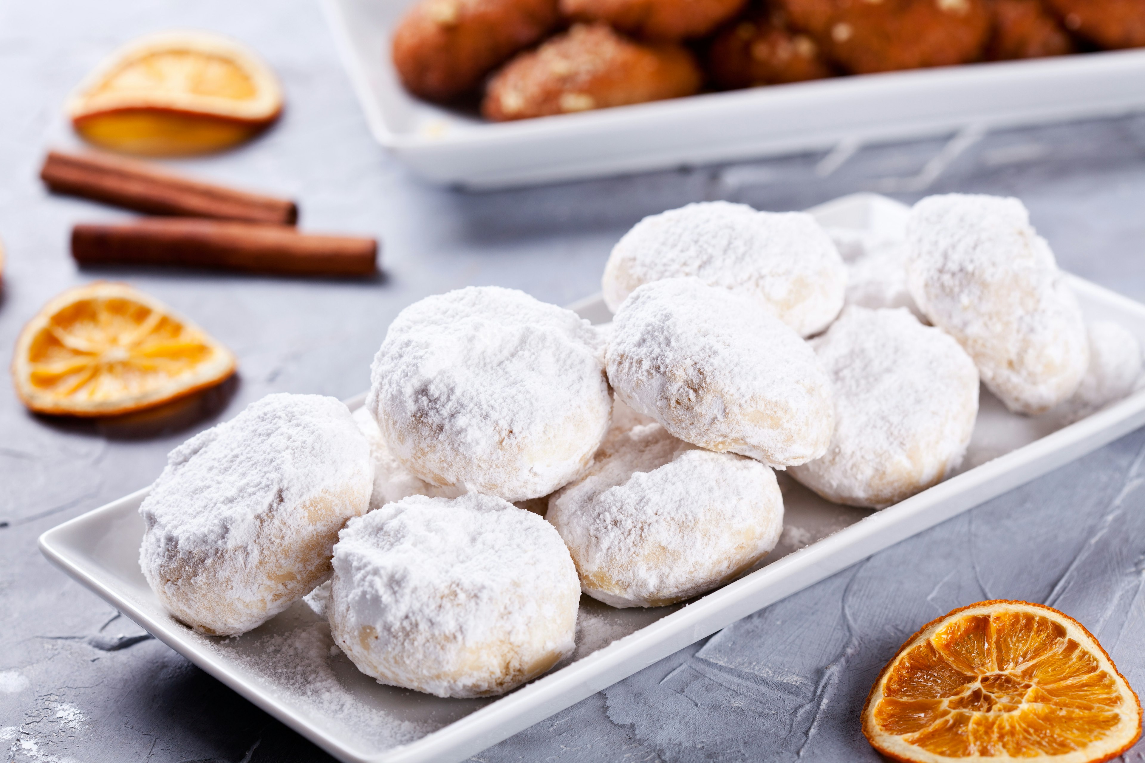 Traditional homemade Greek melomakarona and kourabiedes for Christmas.