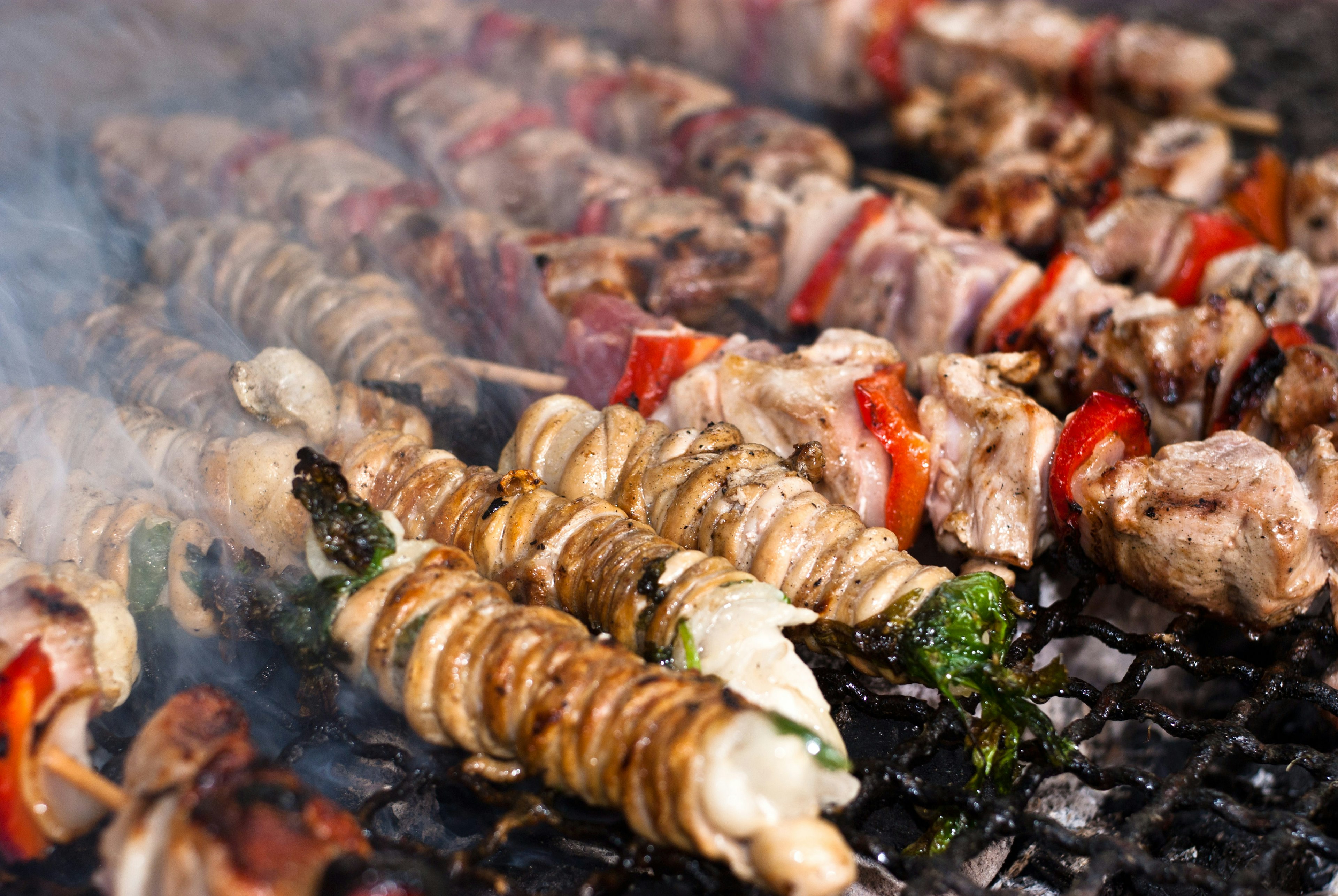 Stigghiole-typical street food in Palermo. Lamb, goat or pork bowels flavored with onions and parsley and grilled over coals