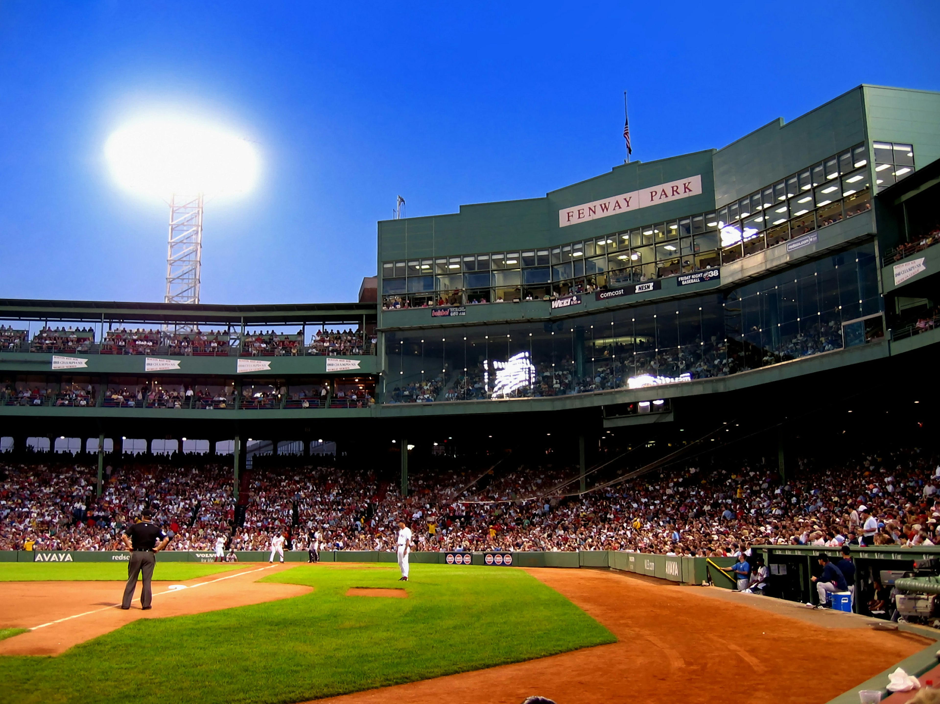 People watching a baseball game in a stadium