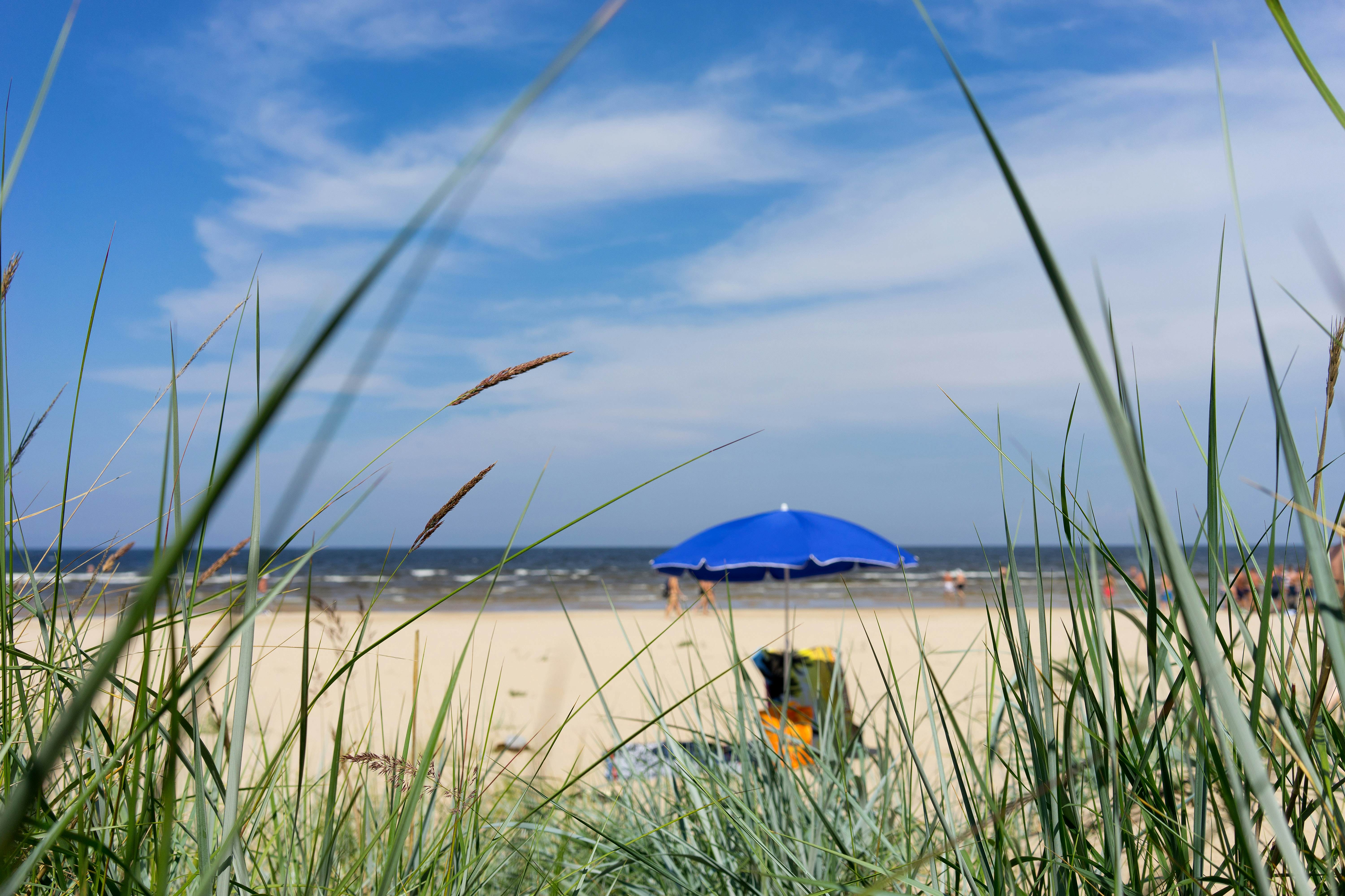 Blue umbrella on a Baltic beach at Jūrmala, Latvia.