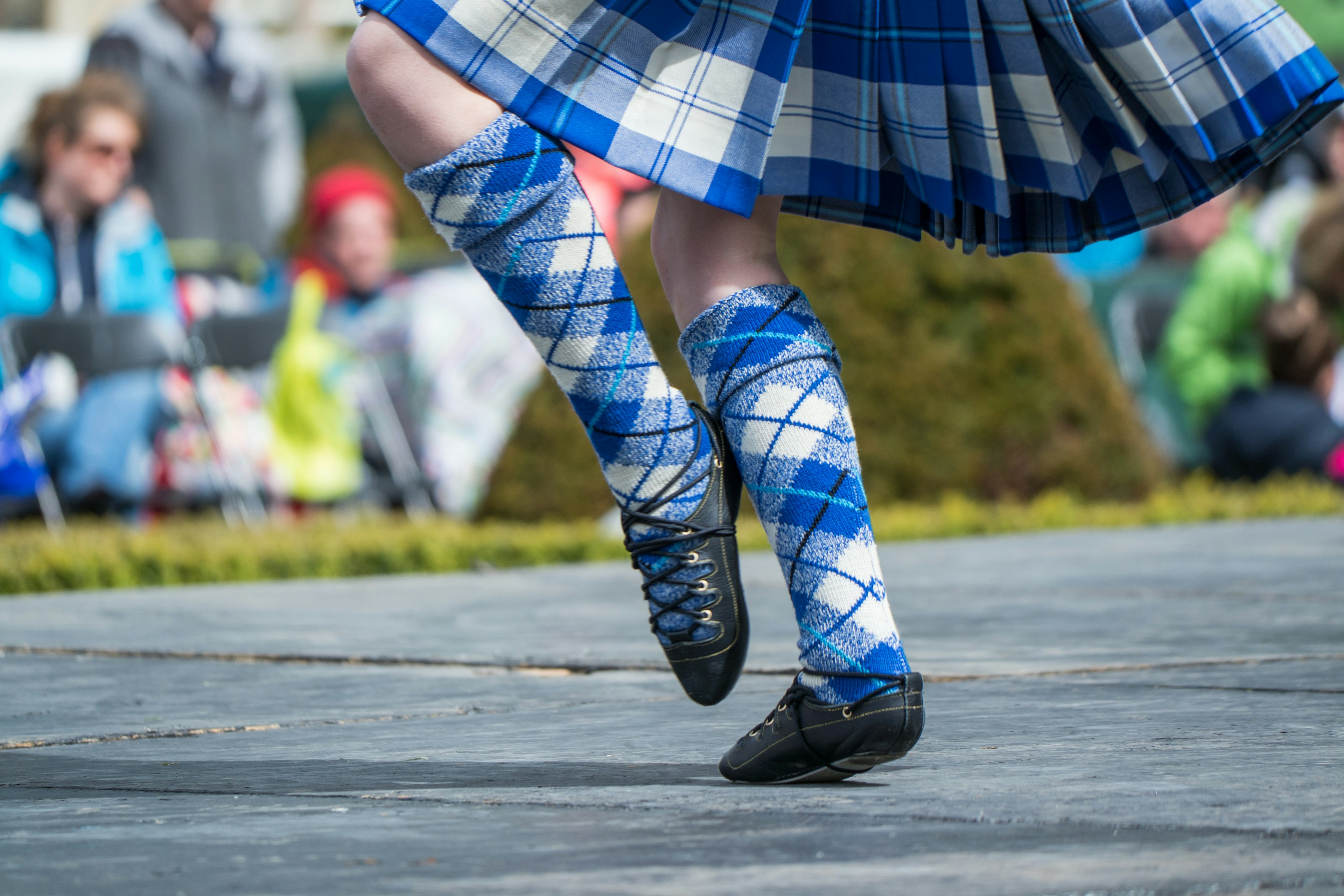 The legs of a traditional Scottish Highland dancer.