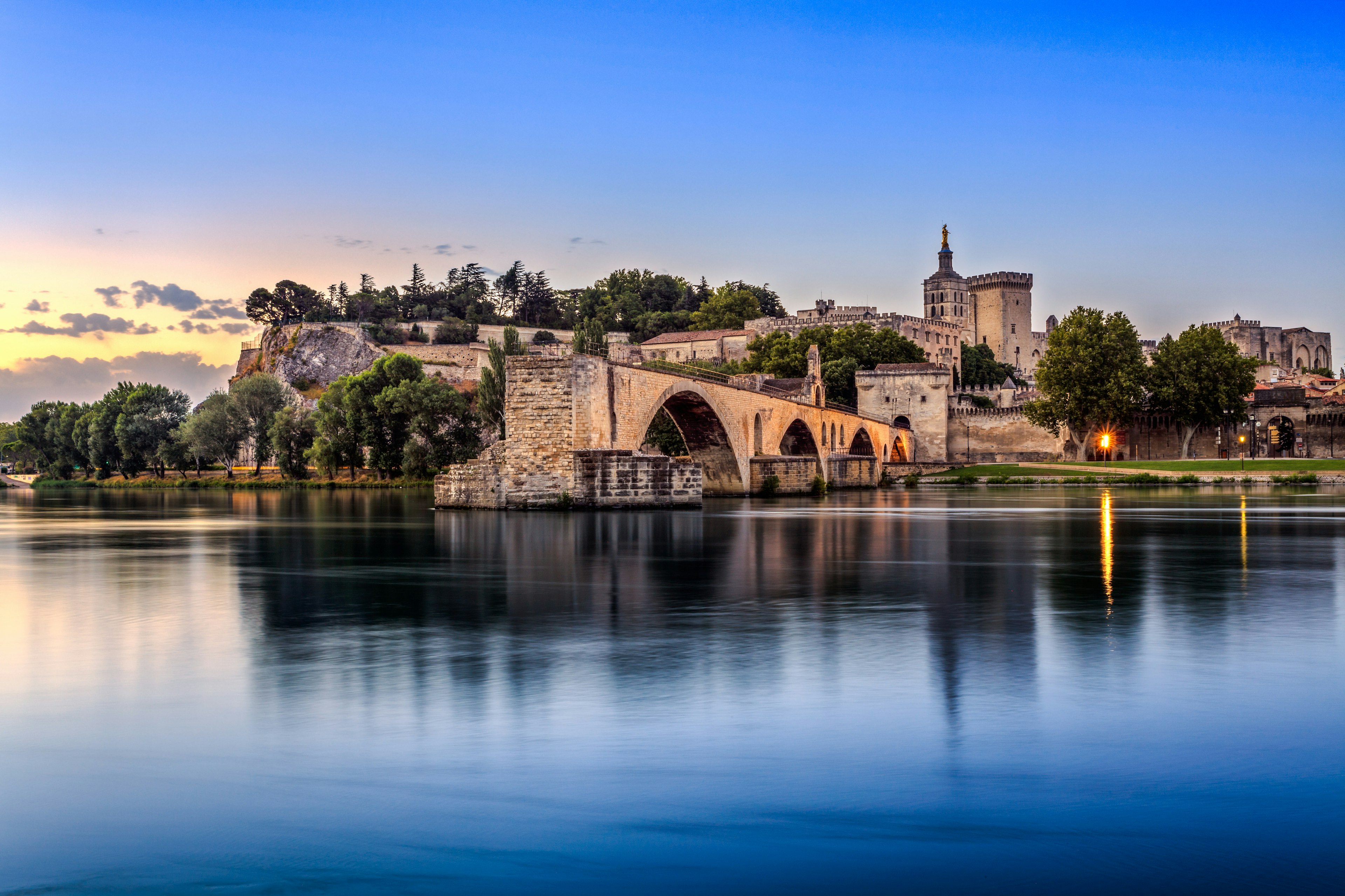 Avignon Bridge with Popes Palace and Rhone river at sunrise, Pont Saint-Benezet, Provence, France.