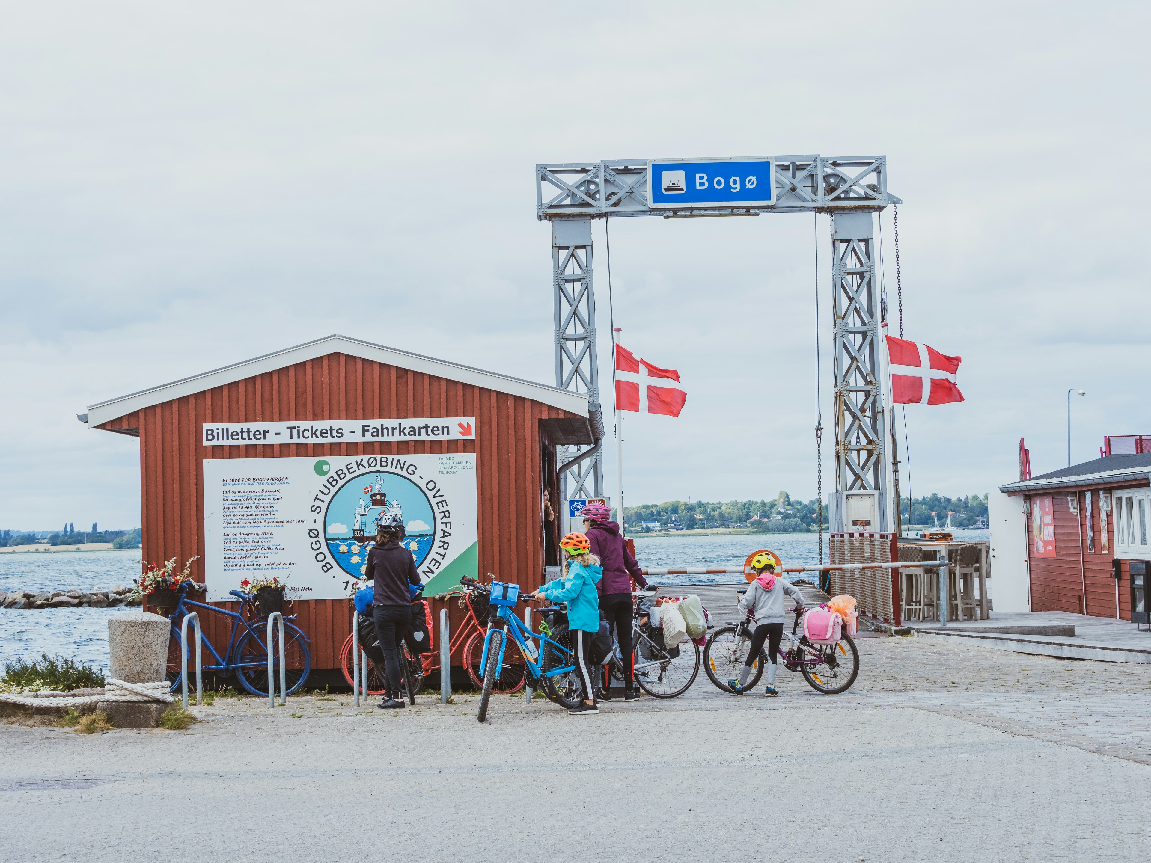 Family and their bikes at Stubbekobing Havn (harbour) waiting for the ferry