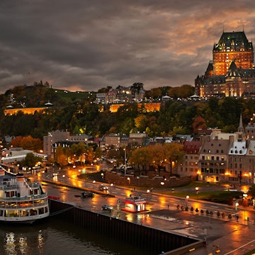 Quebec City after the rain at dusk with view of Le Chateau Frontenac on top of the hill.