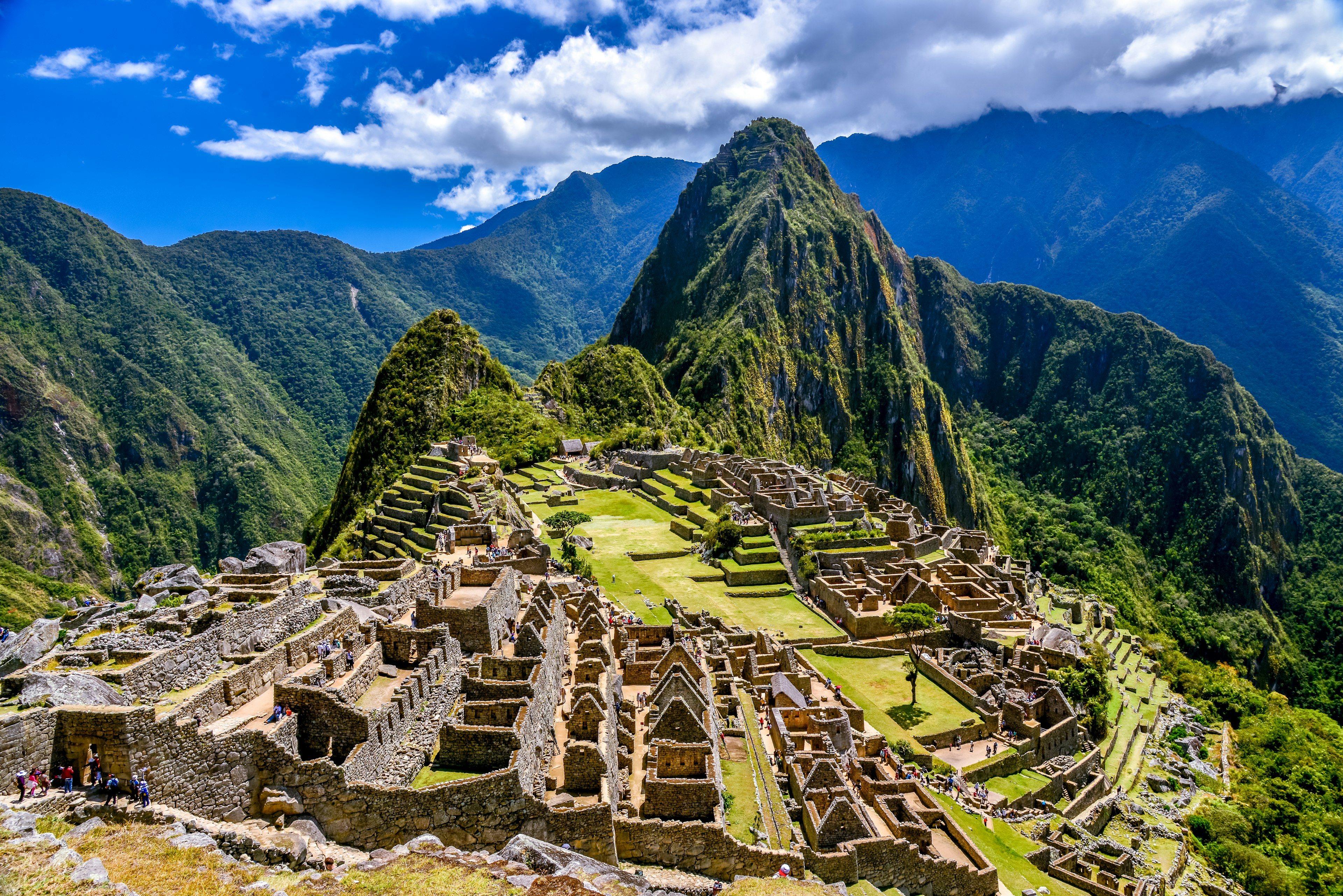 View of Machu Picchu under a blue sky, Peru.