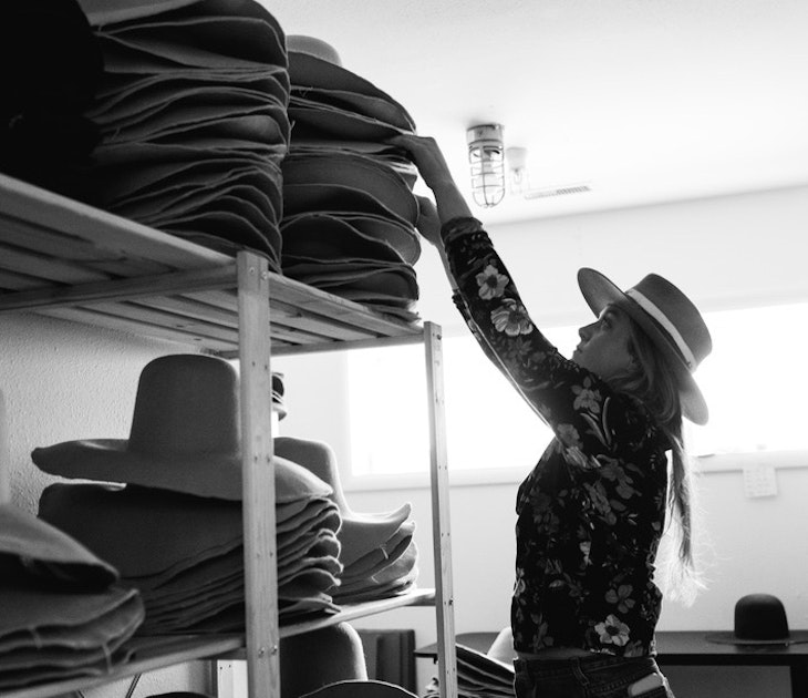 Staff helping customers with hats at JW Bennett in Jackson Hole, Wyoming