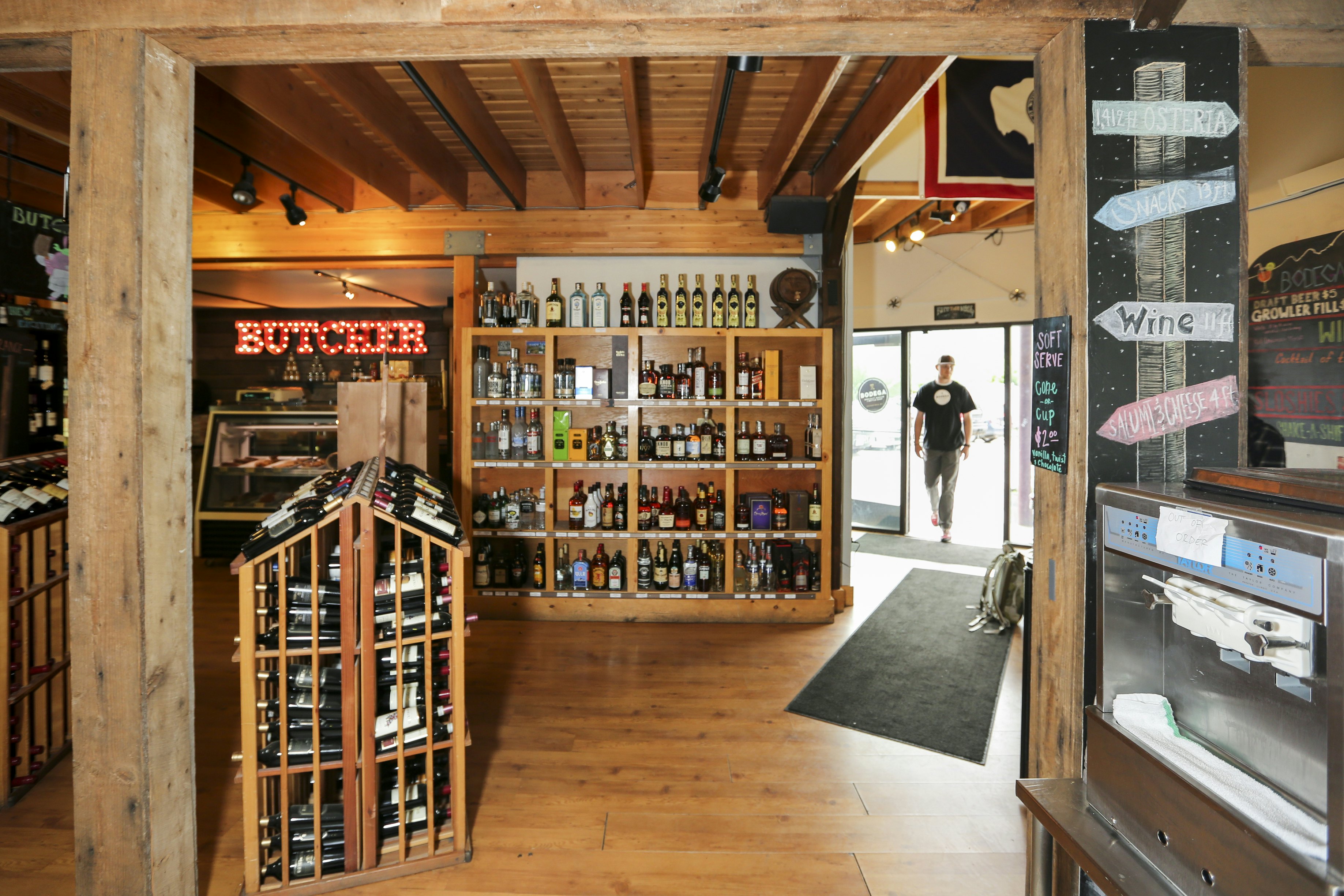 A customer walks into a shop with shelves of liquor and beer for purchase in Jackson Hole, Wyoming