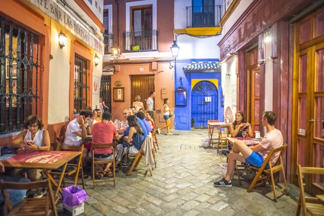People eating at outdoor terraces in Seville