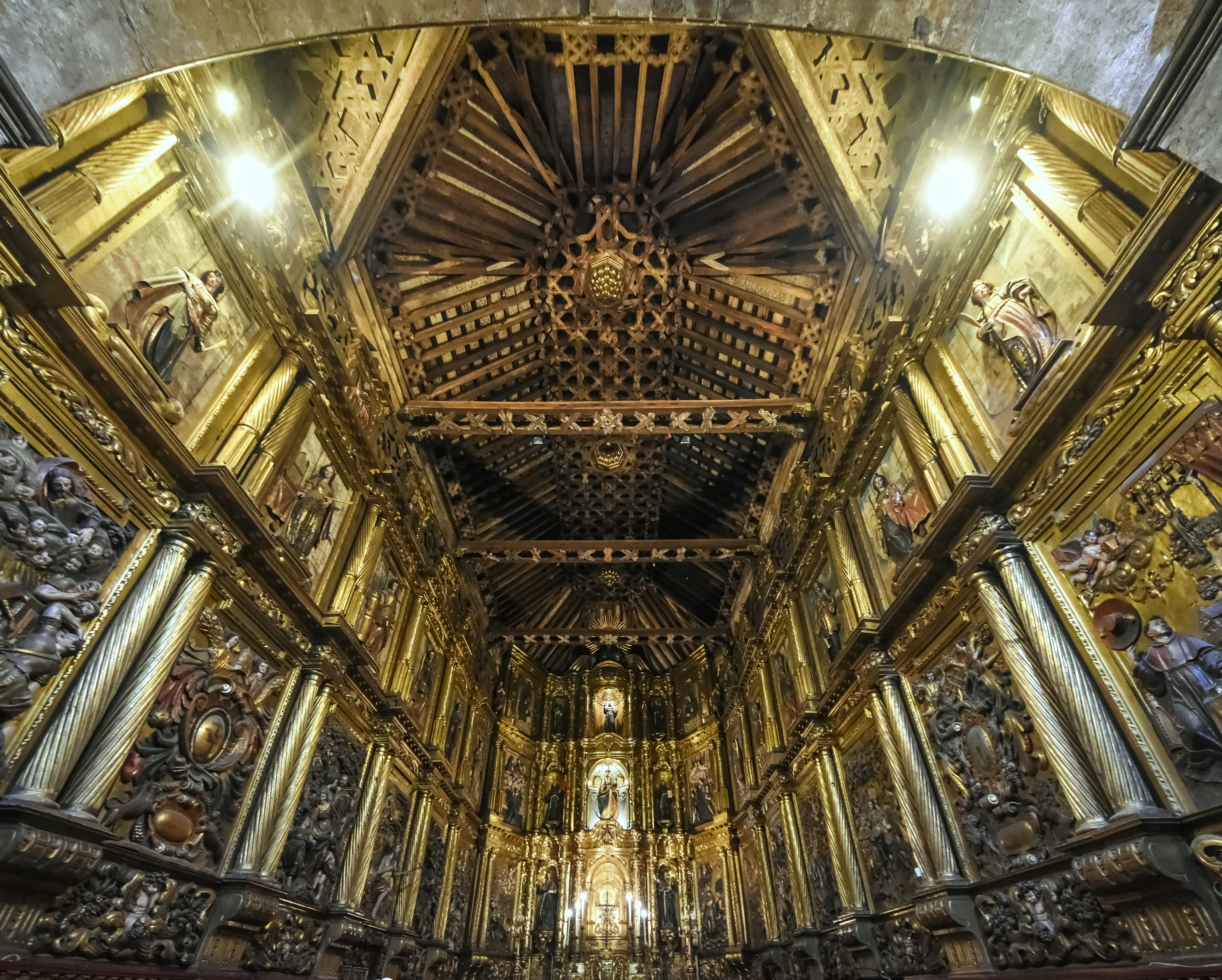 The heavily gilded interior of a church in the baroque style