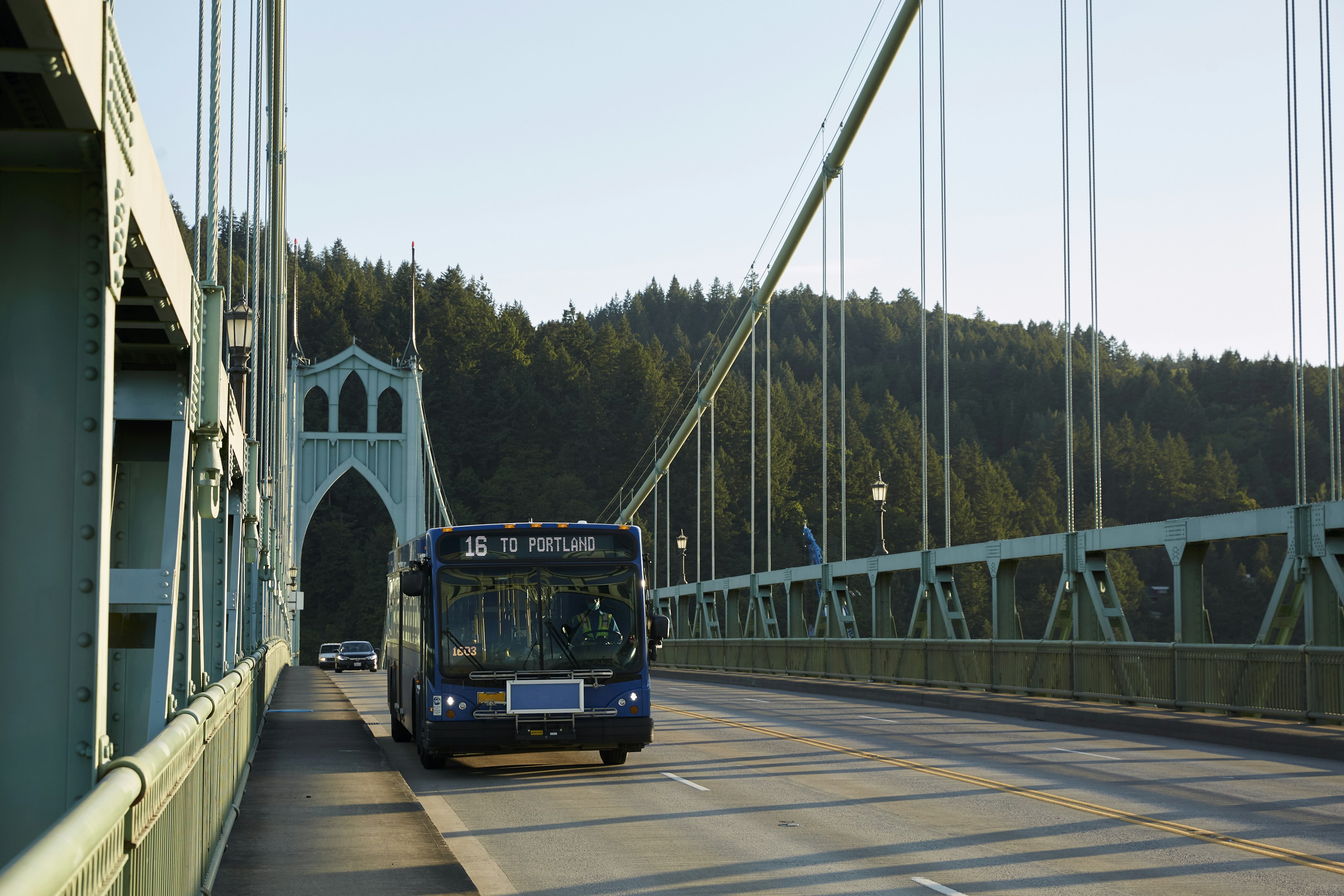 A bus driving over St. Johns Bridge heading to Portland