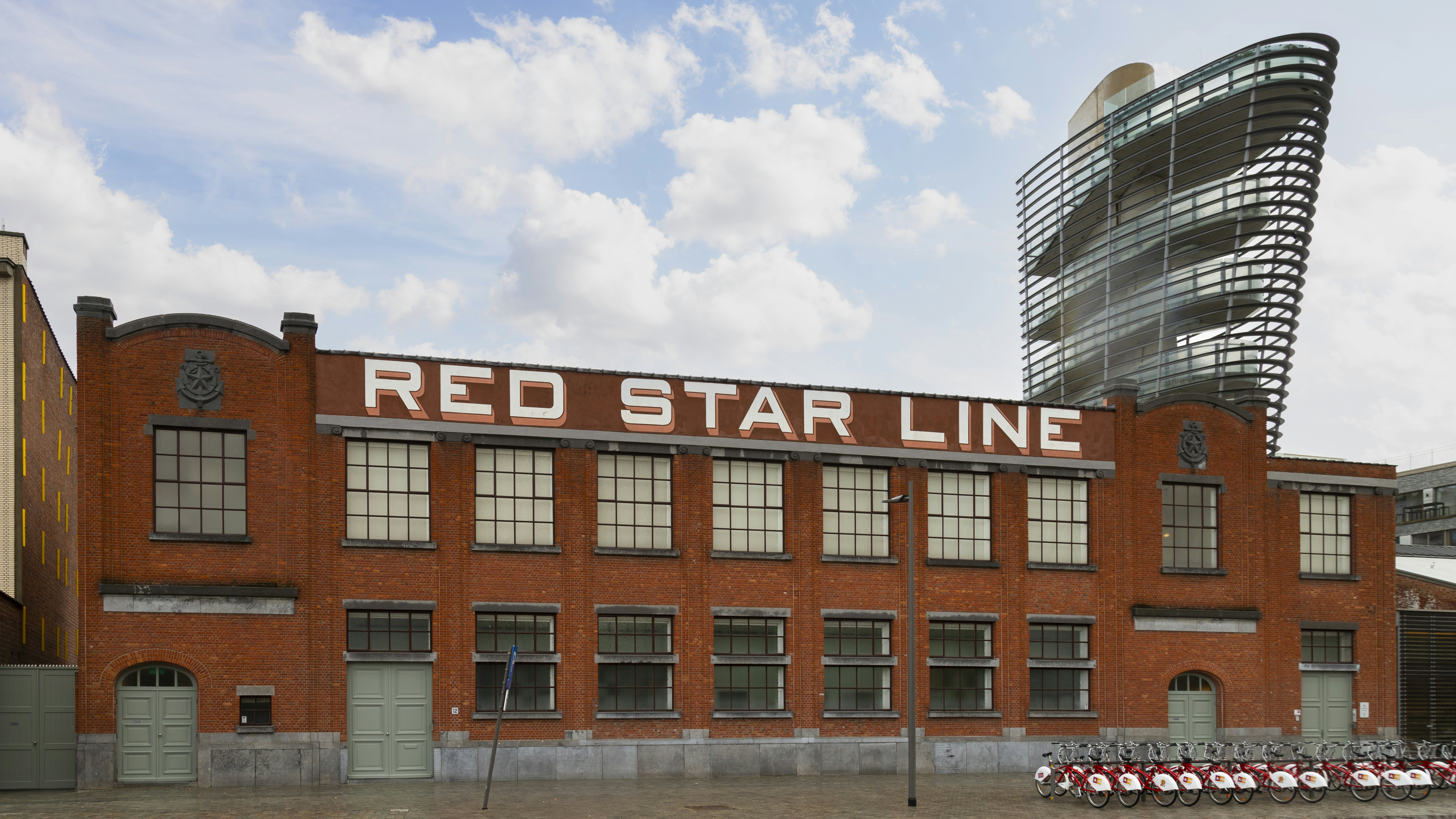 A red-brick building with a large painted sign that says "Red Star Line"