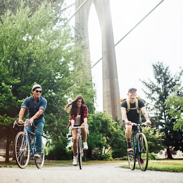 Three friends cycling together in Portland, Oregon