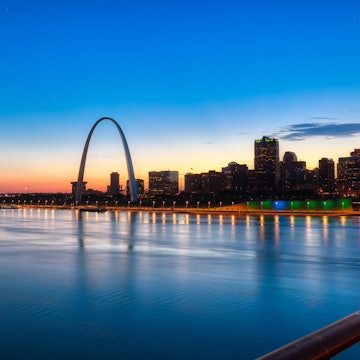 Waterfront buildings in Saint Louis during sunset.
1068659182
Saint Louis, Gateway Arch, Skyline, Urban Skyline, Night, Dusk, Building Exterior, Building, Water, Cityscape, Architecture, Office Building Exterior, Blue, Outdoors, Nature, Sunset, Waterfront, Photography, Color Image, USA, Connection, Skyscraper, City, Travel Destinations, Horizontal, No People, Sky, Illuminated, River, Built Structure