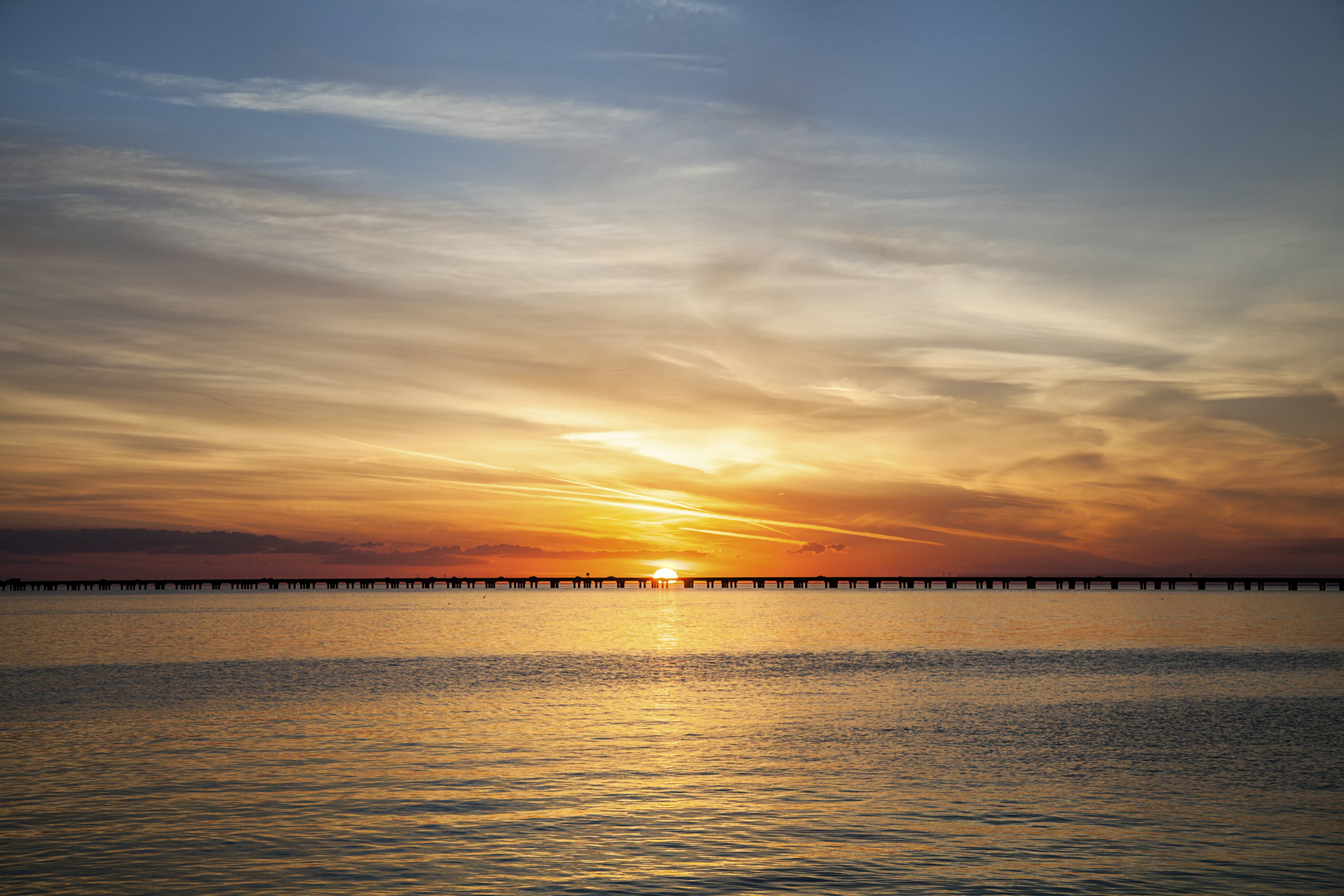 A colorful sunset featuring the Lake Pontchartrain Causeway in Louisiana.