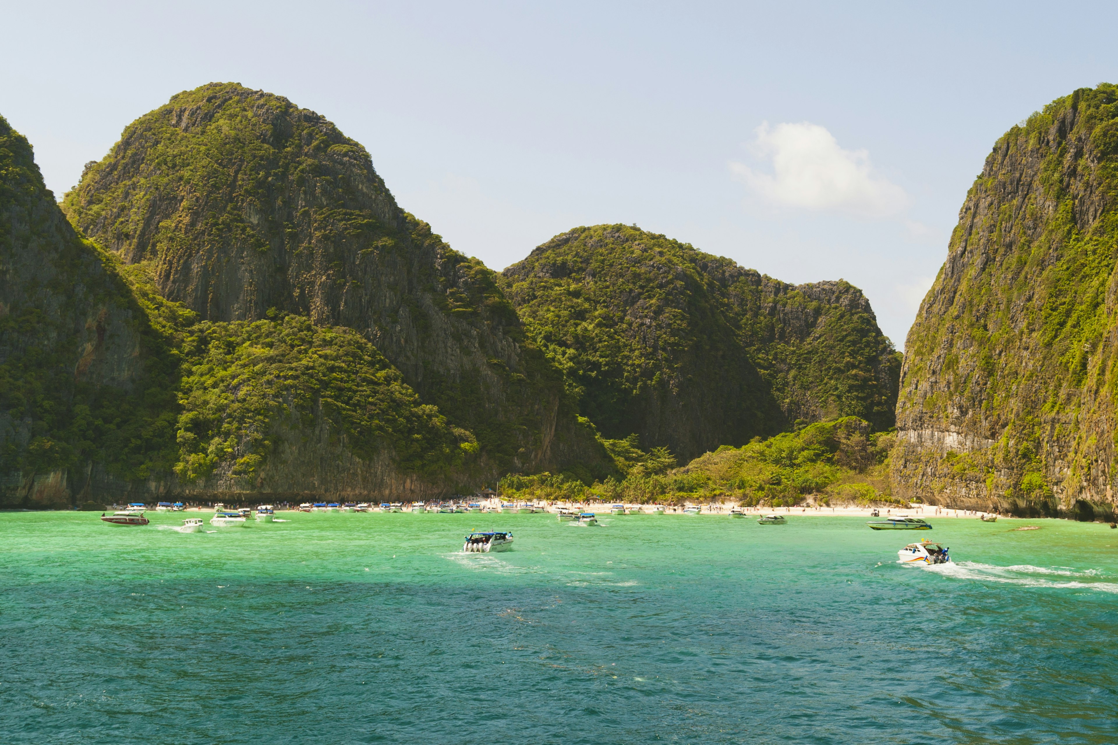 A beautiful island with large hilly sections covered in greenery