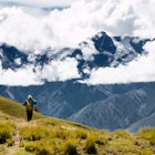 A hiker takes a picture of snow-capped mountains on the Inca Trail.
641746678
People Nature Vacations Travel Destinations Horizontal Full Length Outdoors South America Hiking Peru Footpath Landscape Mountain Mountain Peak Andes Machu Picchu High Up One Person Scenics - Nature Inca Trail To Machu Picchu Color Image Photography Backpacker UNESCO World Heritage Site Wilderness