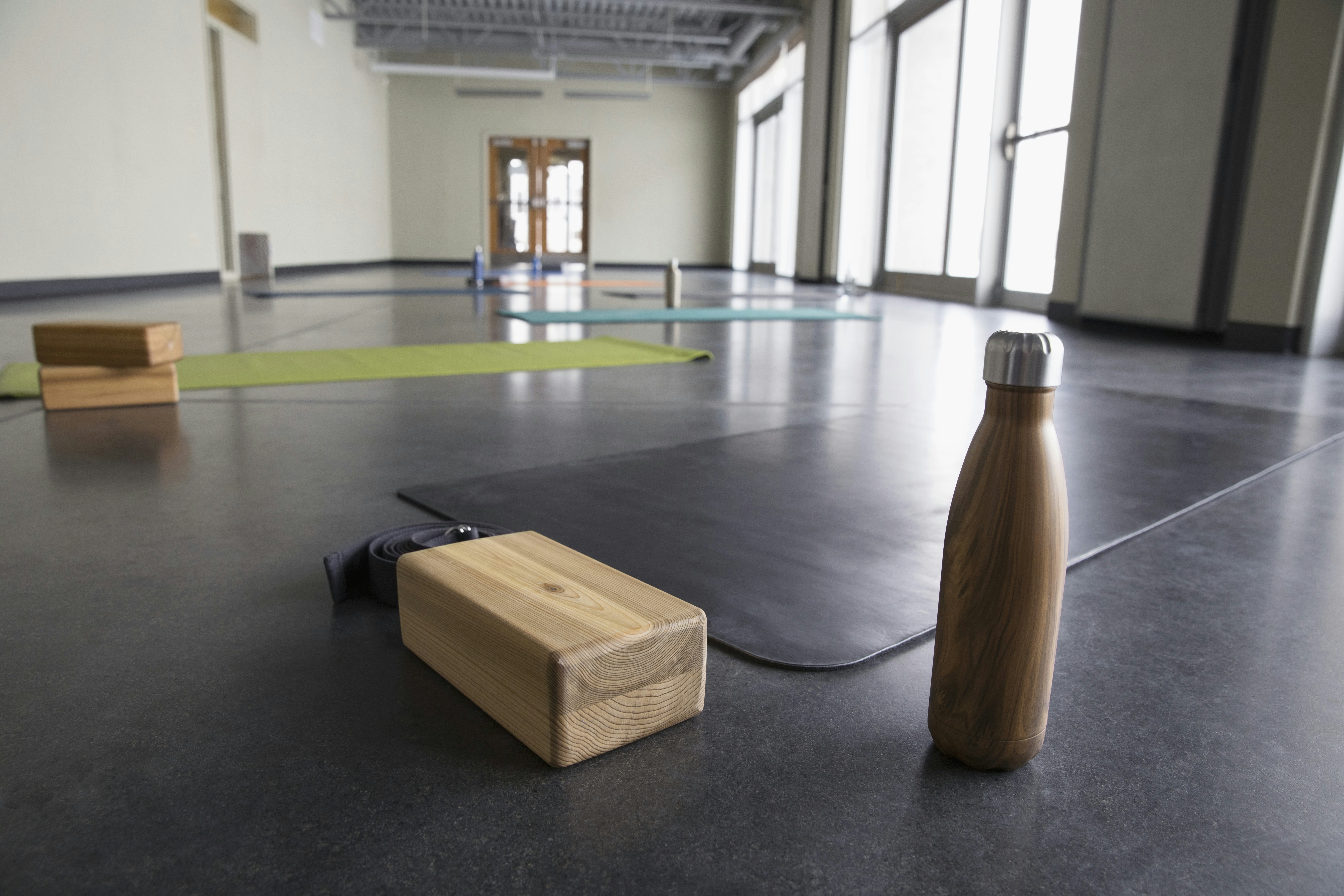 Yoga mats and blocks in a studio.