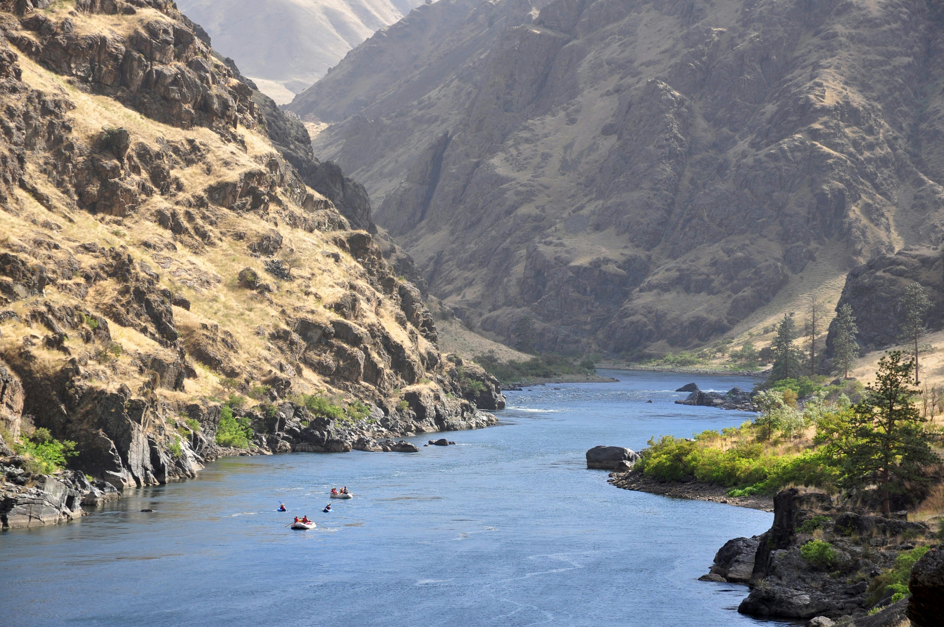 Rafts and kayaks descend the Snake River in Hells Canyon on the border between Idaho and Oregon.