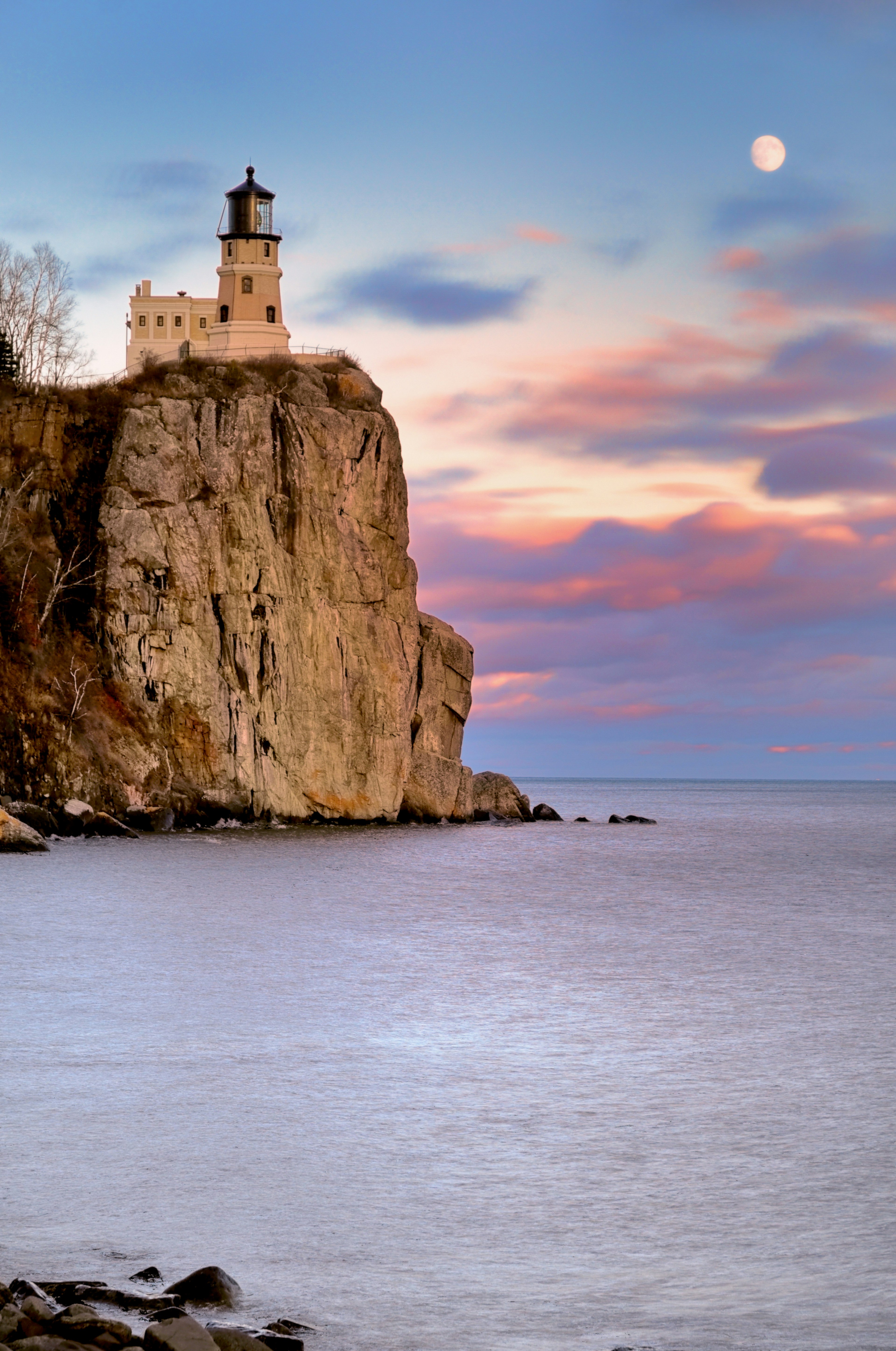 Split Rock Lighthouse on the coast during twilight.