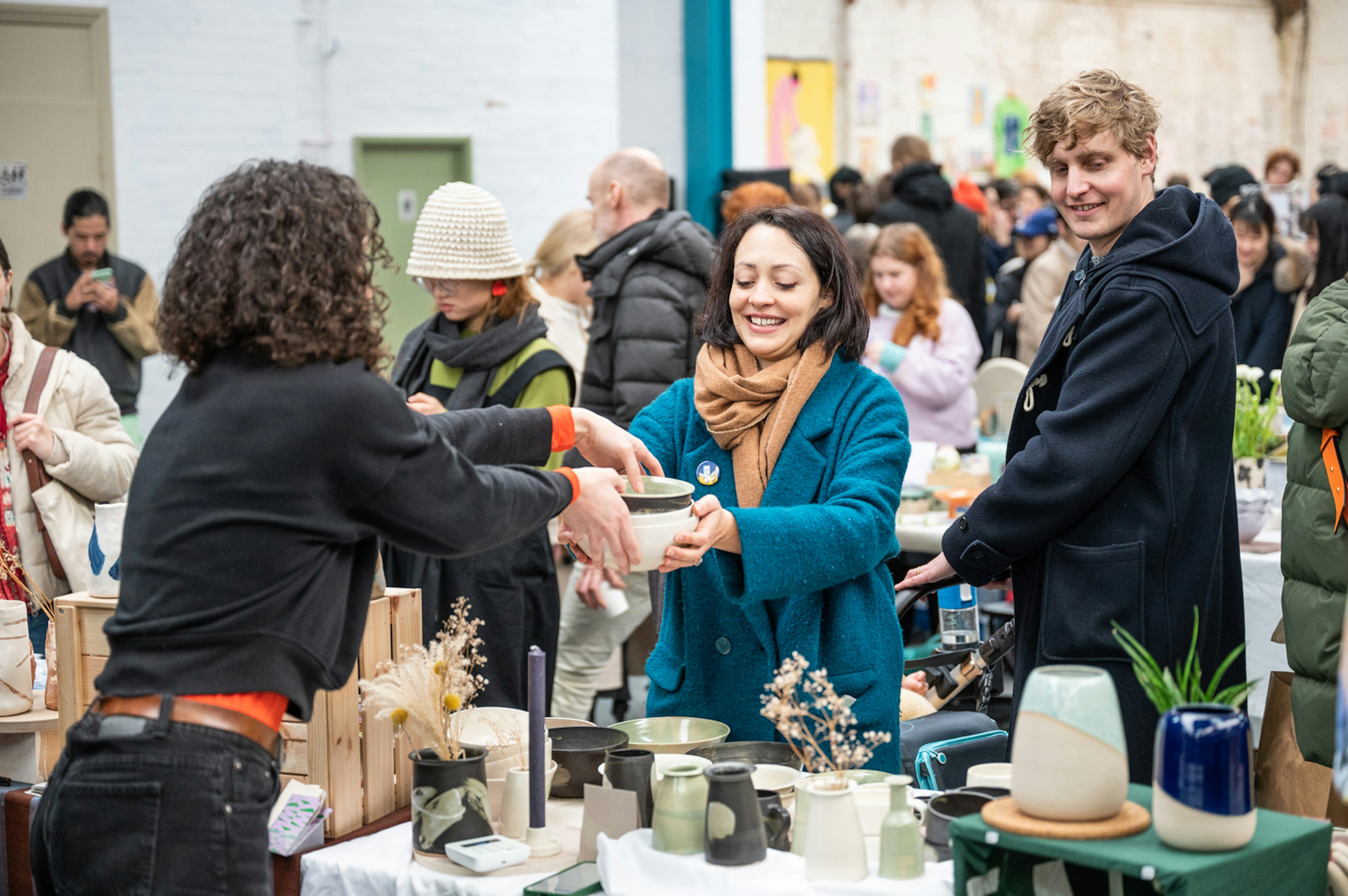 Customers purchasing ceramics at DIY Art Market