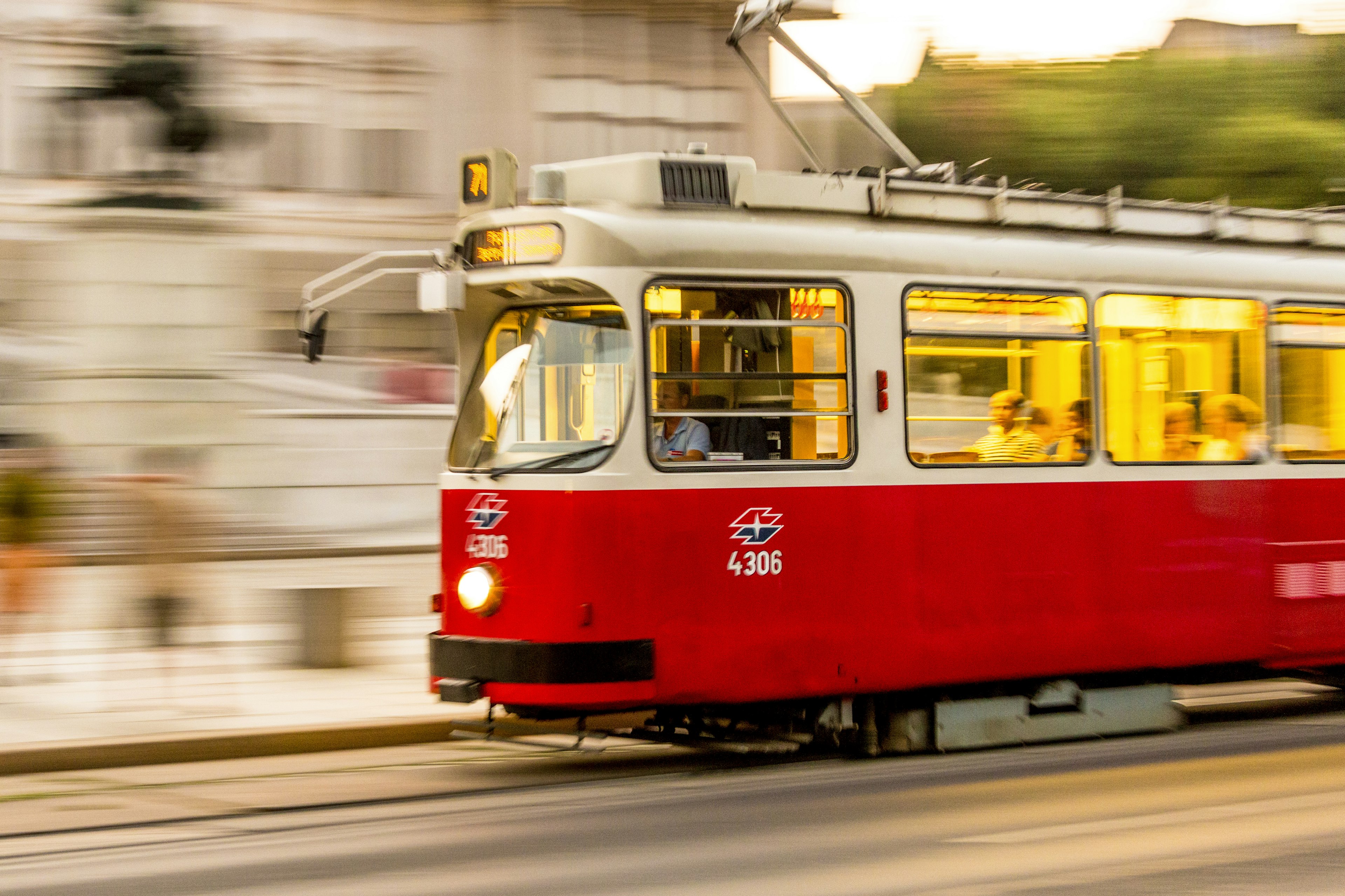 Tram in Vienna, photographed with a lot of motion blur in the background.