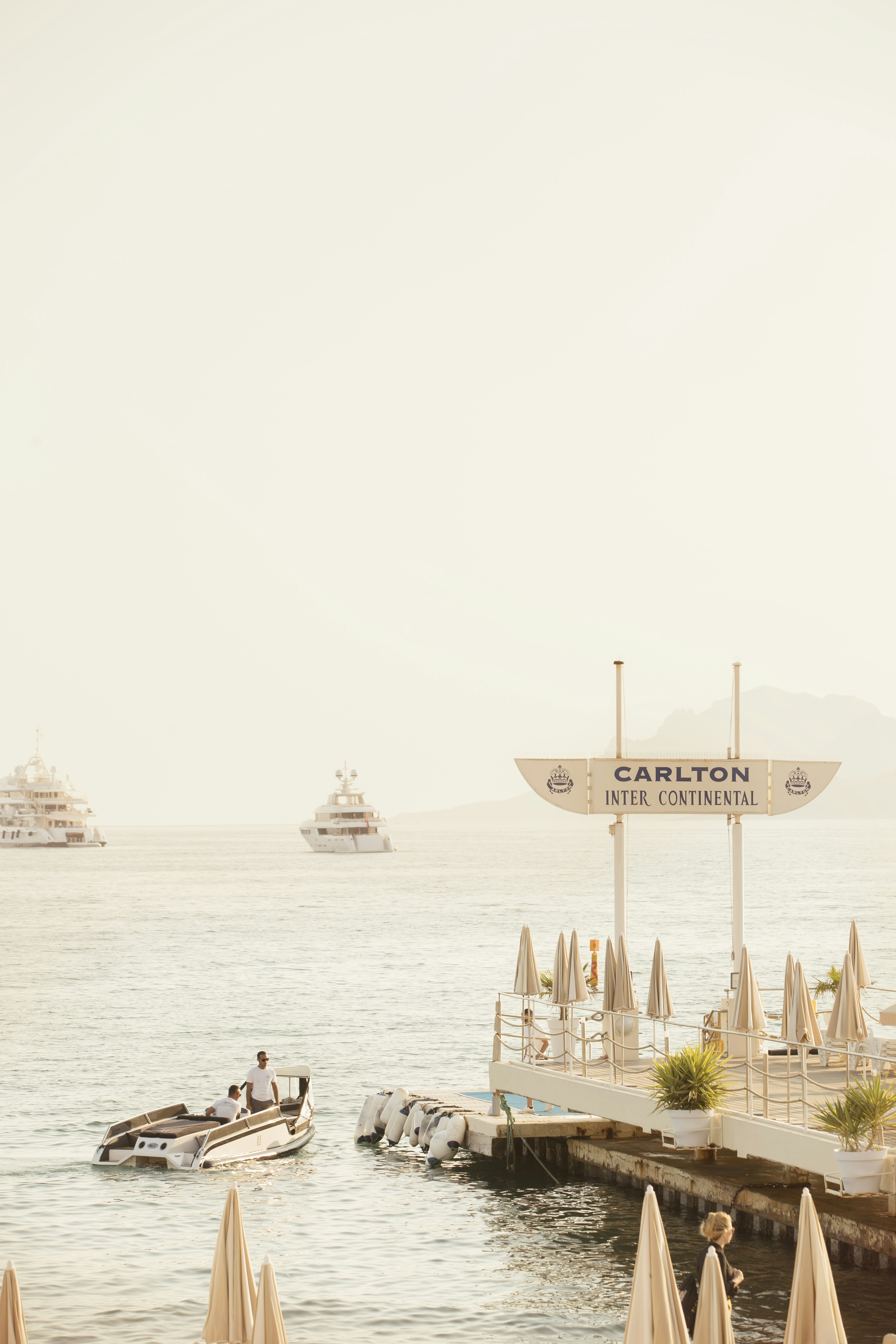 \A boat leaves the pier on the waters edge in the Carlton Beach Club..