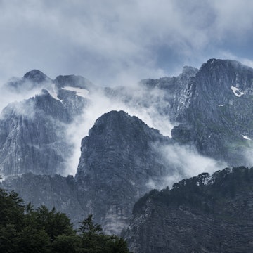 Thin cloud and patches of snow on the heights of the Accursed Mountains