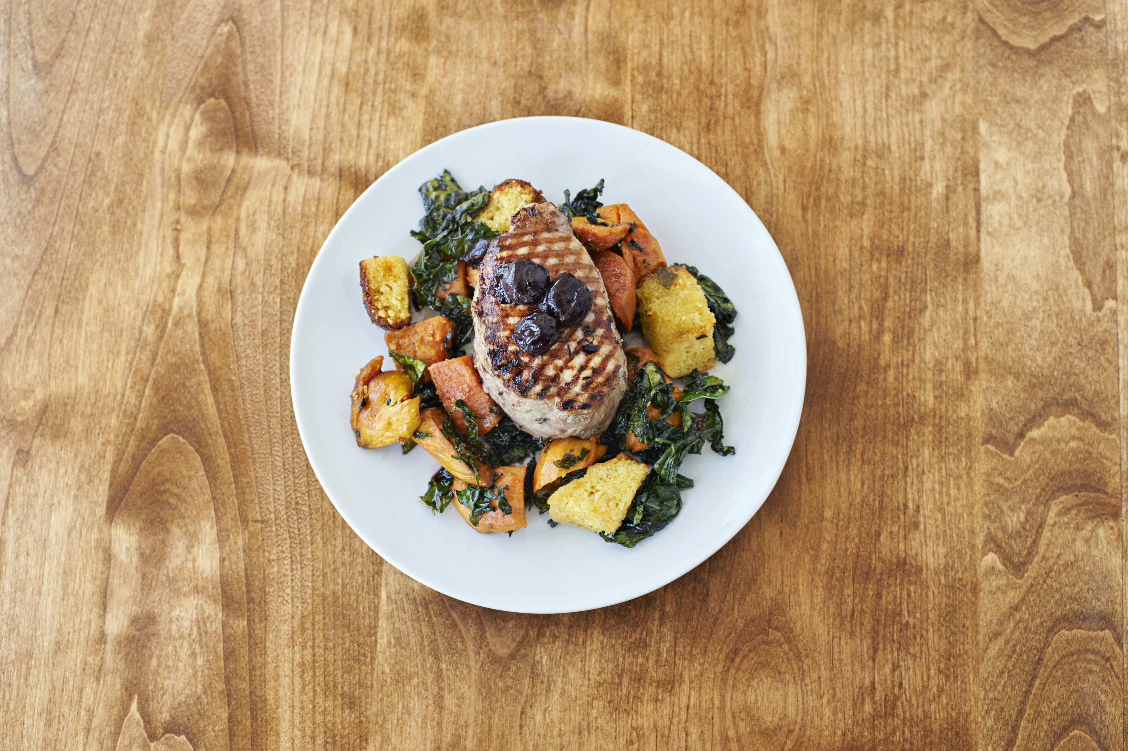 A well-presented pork dish from Ostrich Farm's menu.