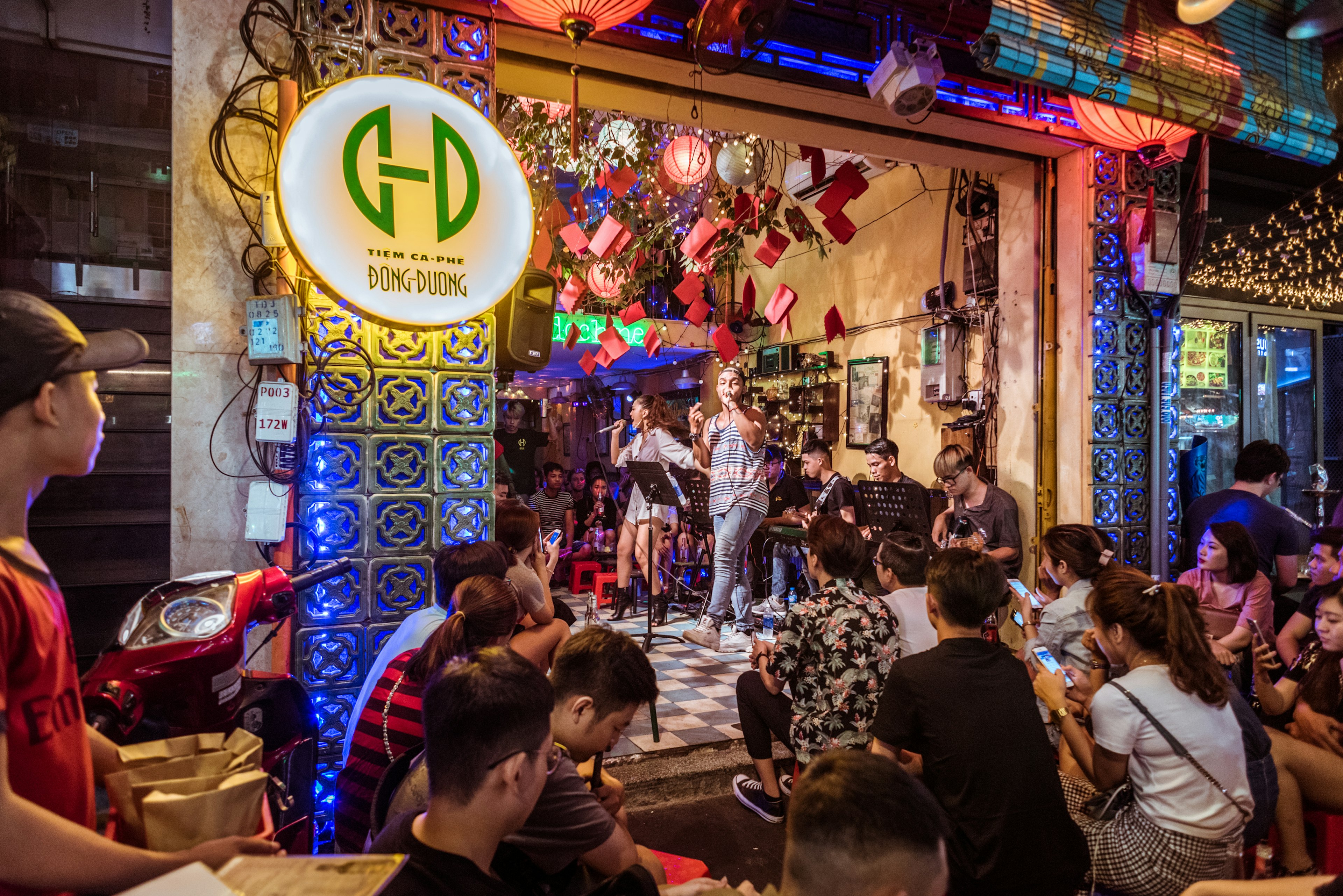 A music band performs surrounded by visitors at Dong Duong Cafe in Bui Vien Street that is famous with its nightlife.