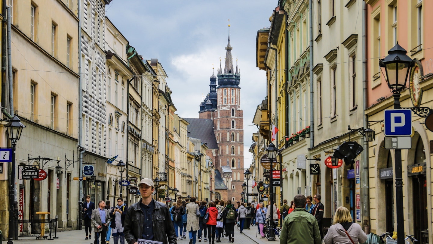 Tourists walking through the old city of Krakow