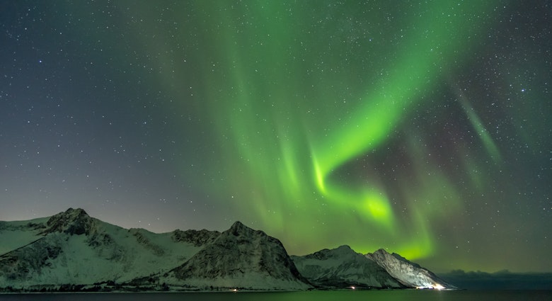 Northern lights, Aurora Borealis, with the Husfjellet mountain, Tungeneset, Senja Island, Troms Norway Europe  License Type: media  Download Time: 2023-08-01T15:50:51.000Z  User: FergalCo  Is Editorial: No  purchase_order: