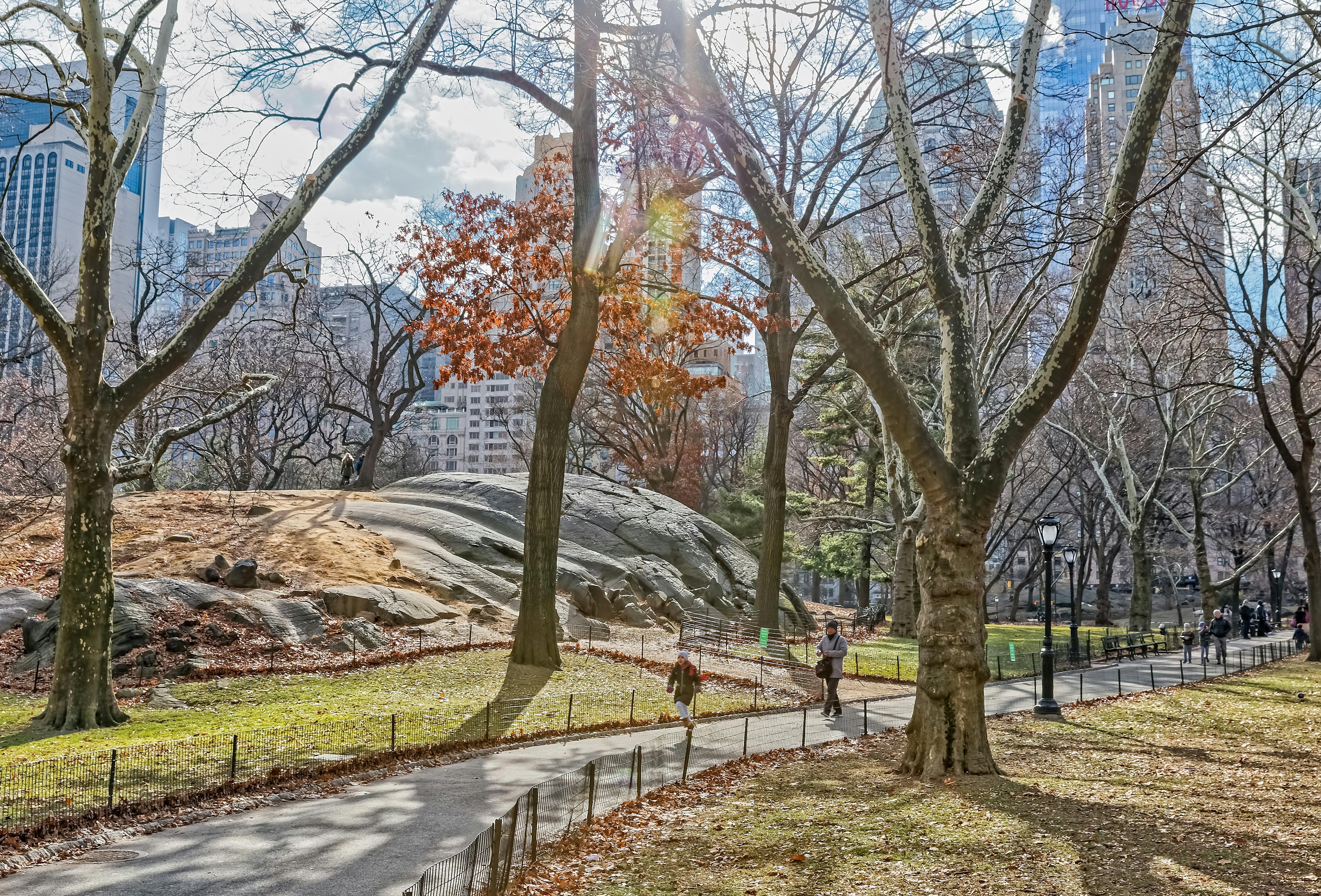 NEW YORK, USA - JANUARY 15, 2018: Beautiful walkway by the glacial rocks in Central Park in winter season.